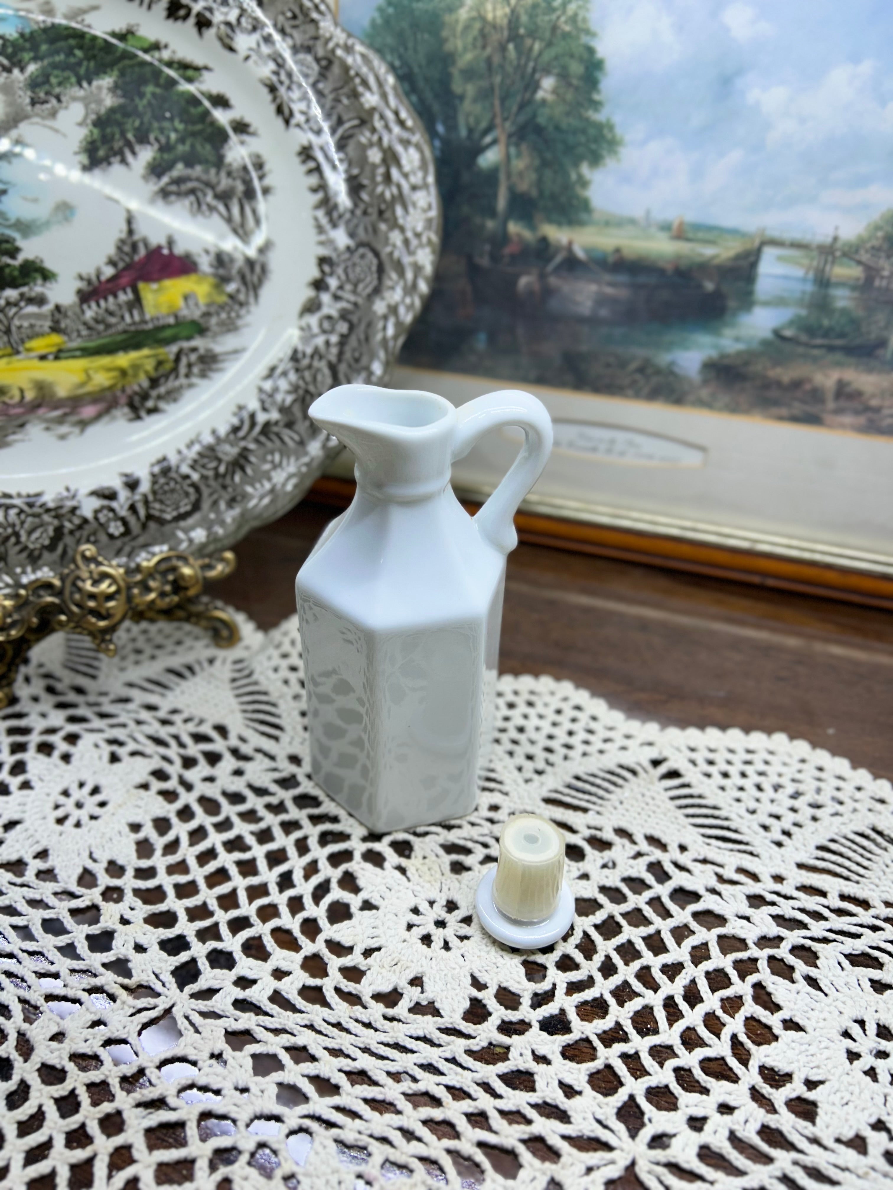 Vintage Xcell white porcelain oil or vinegar cruet with a stopper
