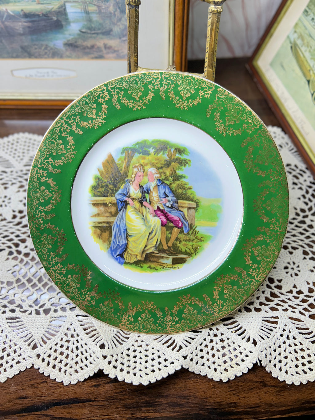 French porcelain display wall plate featuring a Fragonard courting couple scene 11”