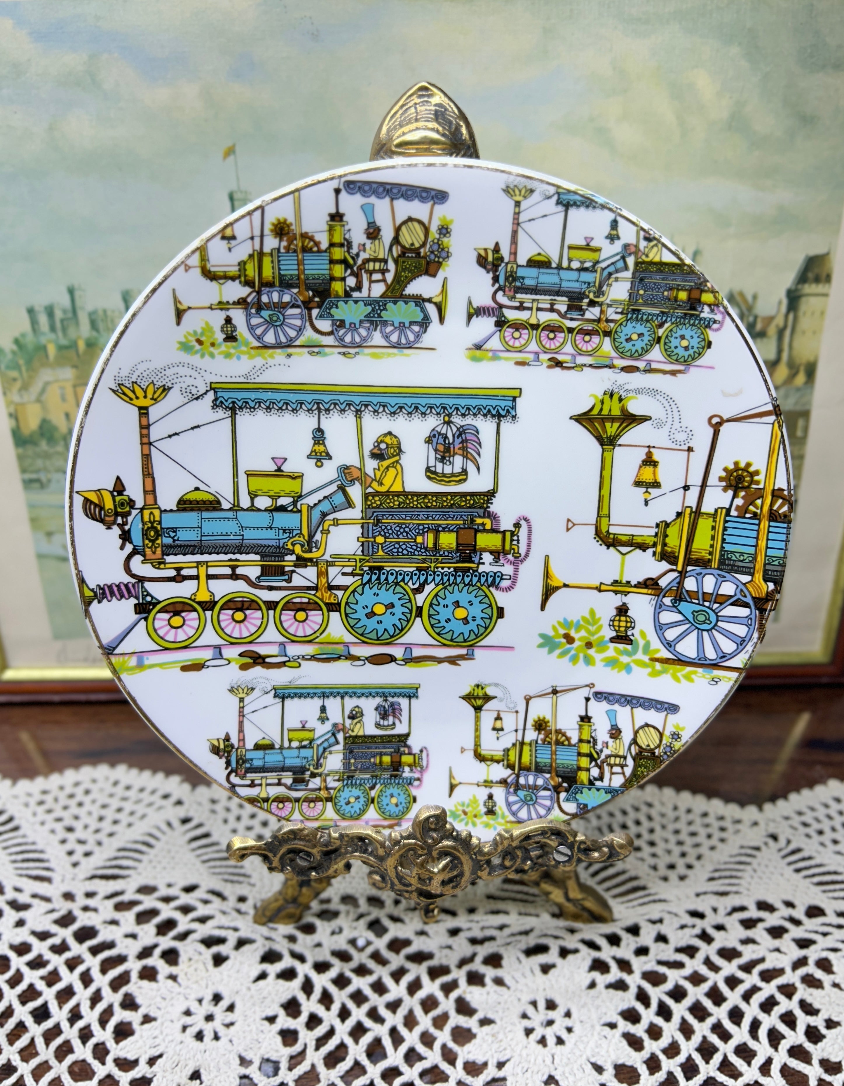 Vintage Gustavsberg wall plate — crafted in Sweden from flint porcelain features a detailed motif of historic trains 8”