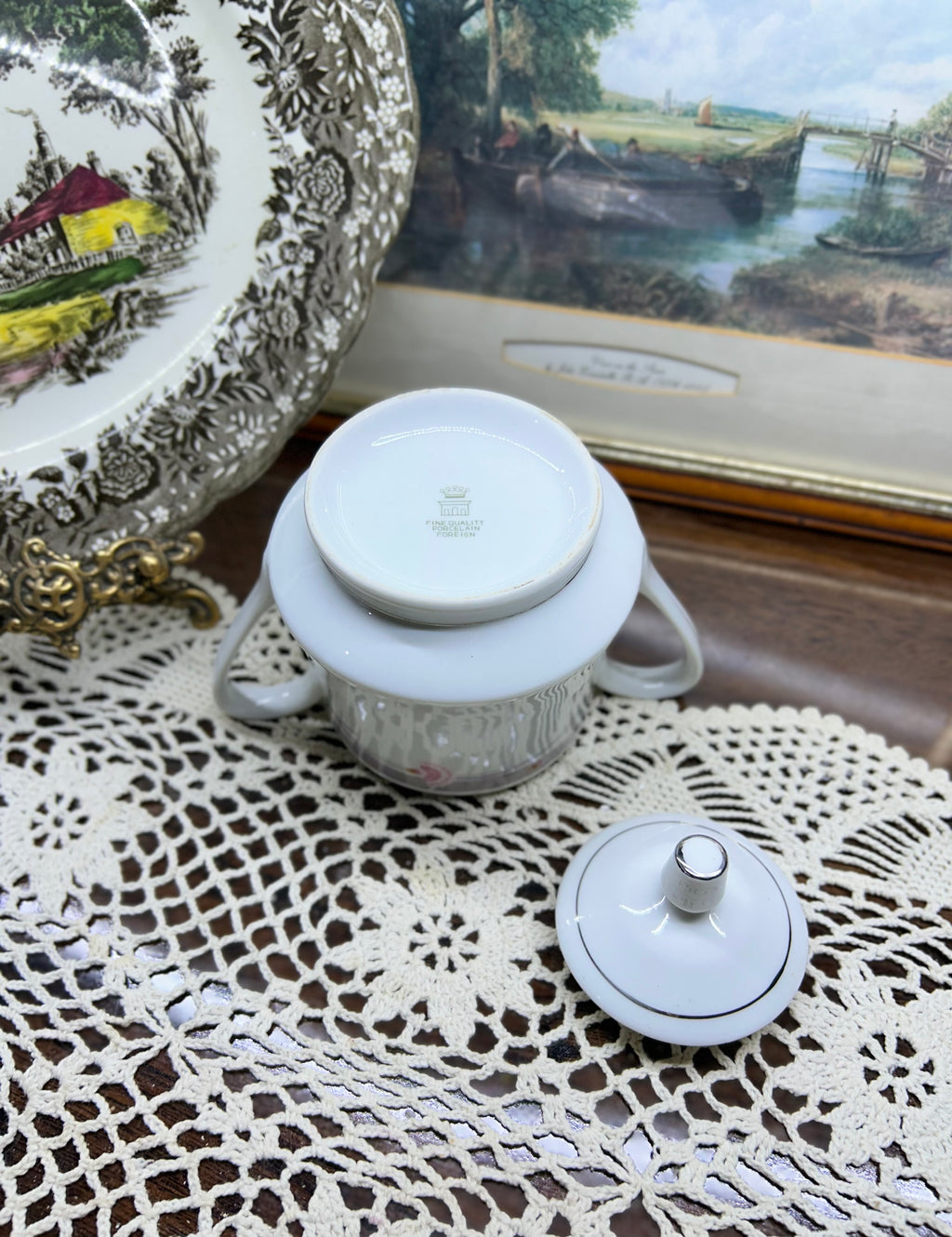 Vintage porcelain lidded sugar pot with silver rim
