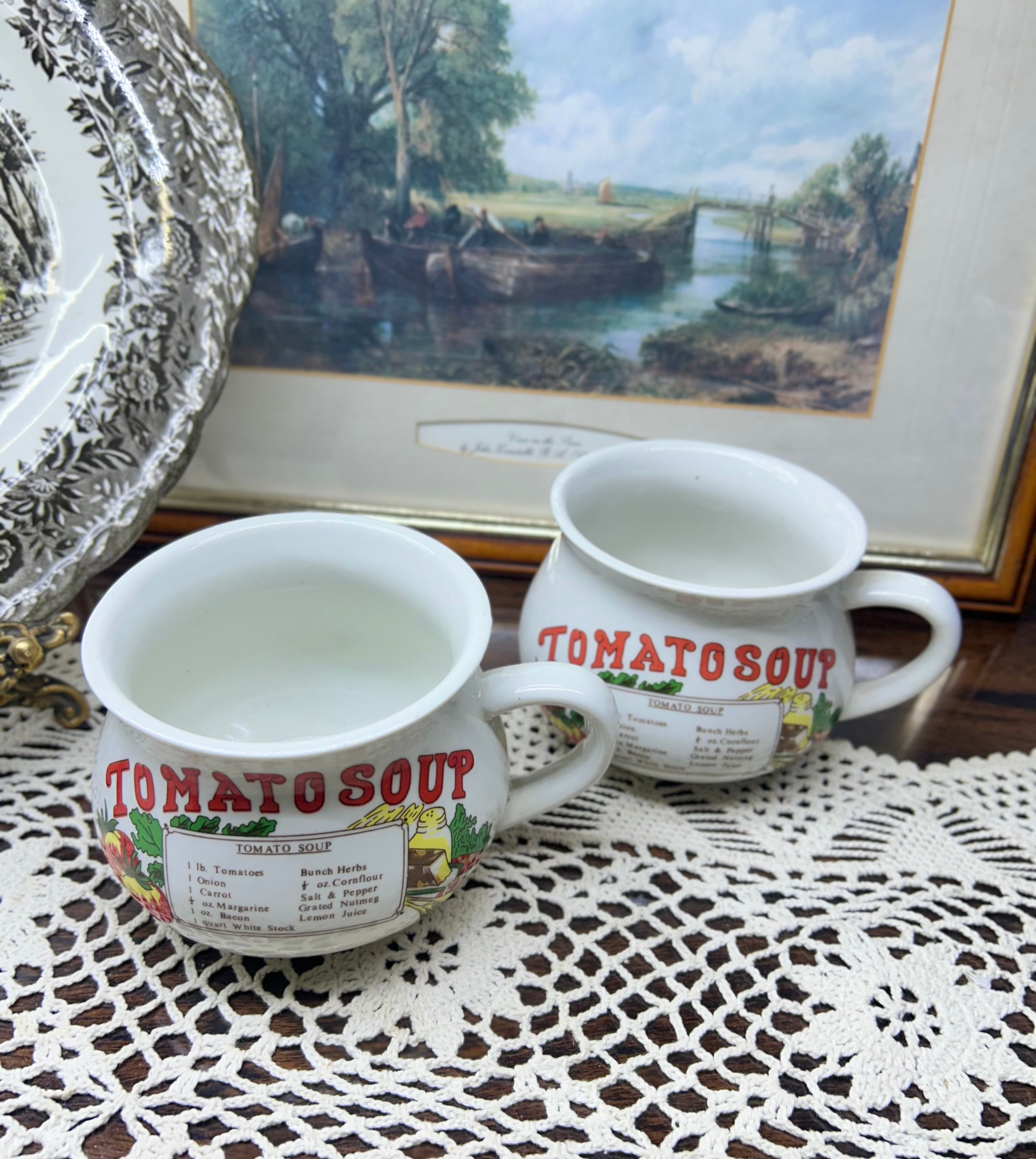 Retro ceramic soup mugs featuring tomato Soup recipe design.
