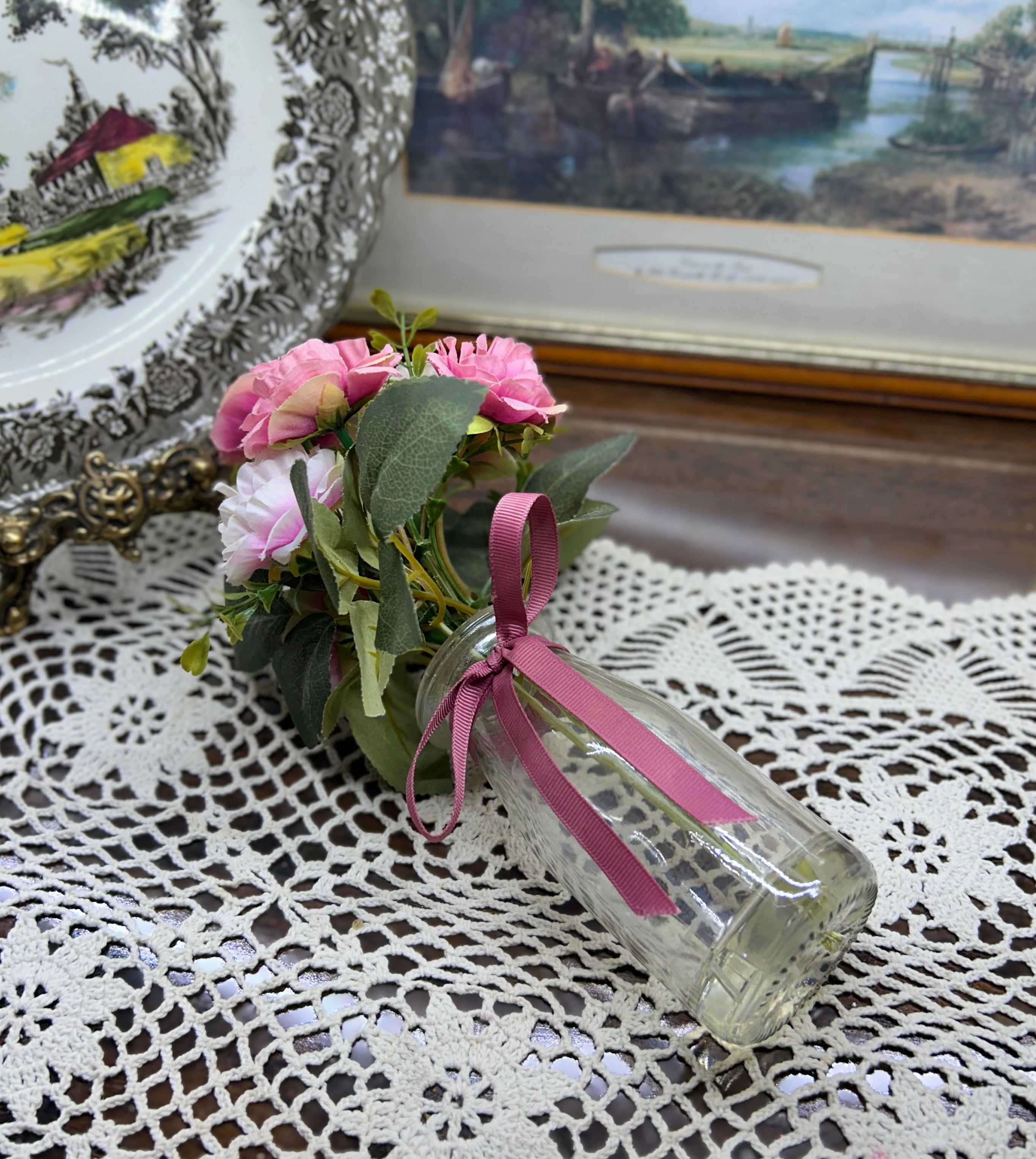 Decorative faux peonies arrangement in a glass gel vase