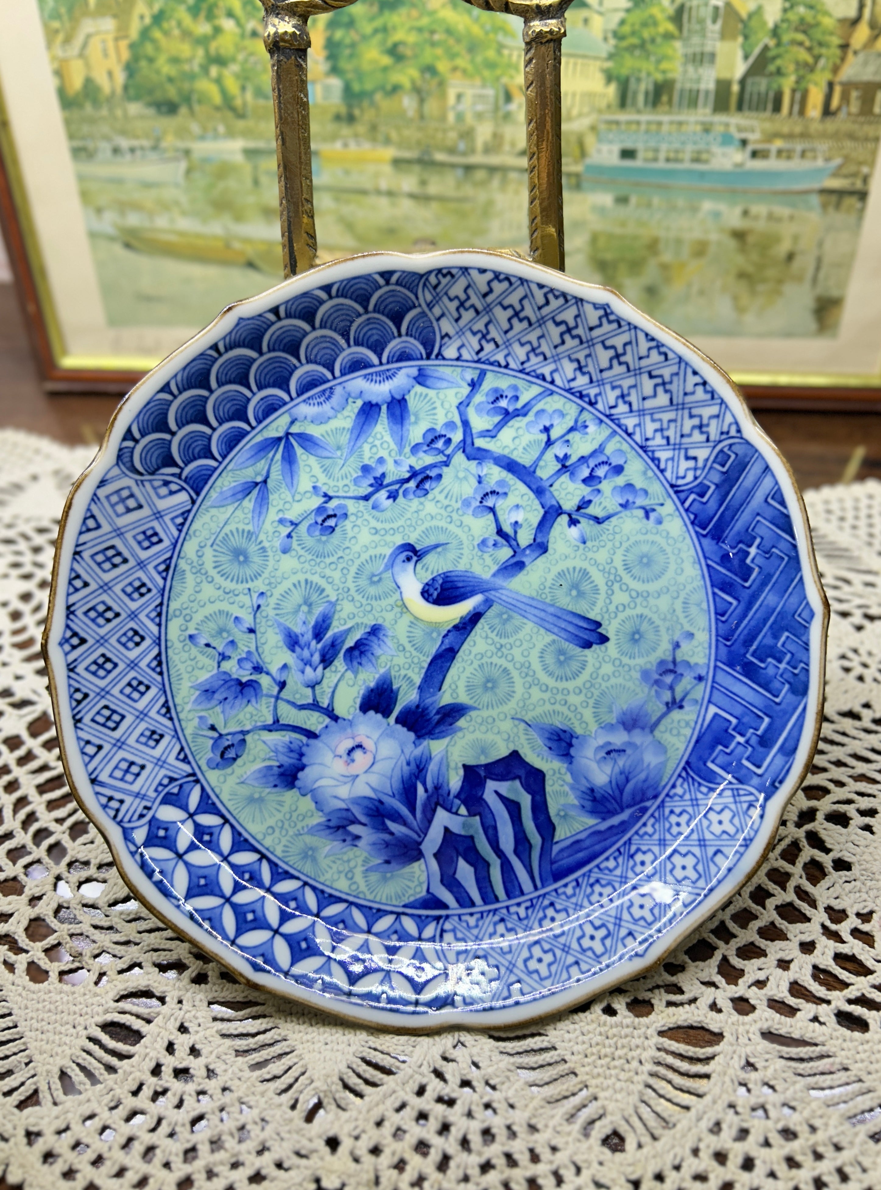 Japanese Arita-yaki porcelain plate features a detailed bird and floral motif 7”