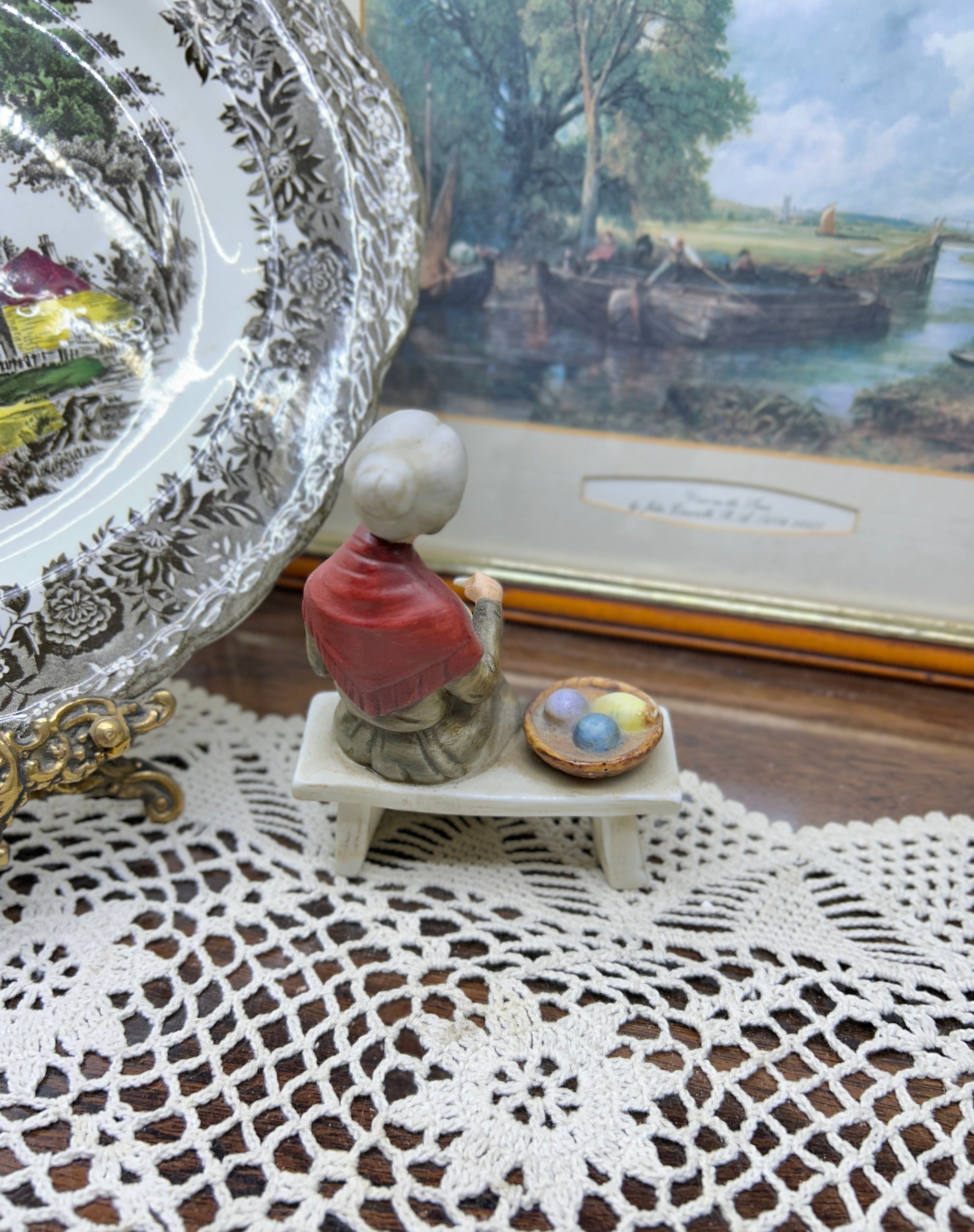 Vintage capodimonte figurine featuring an old lady sitting on a bench —  5”