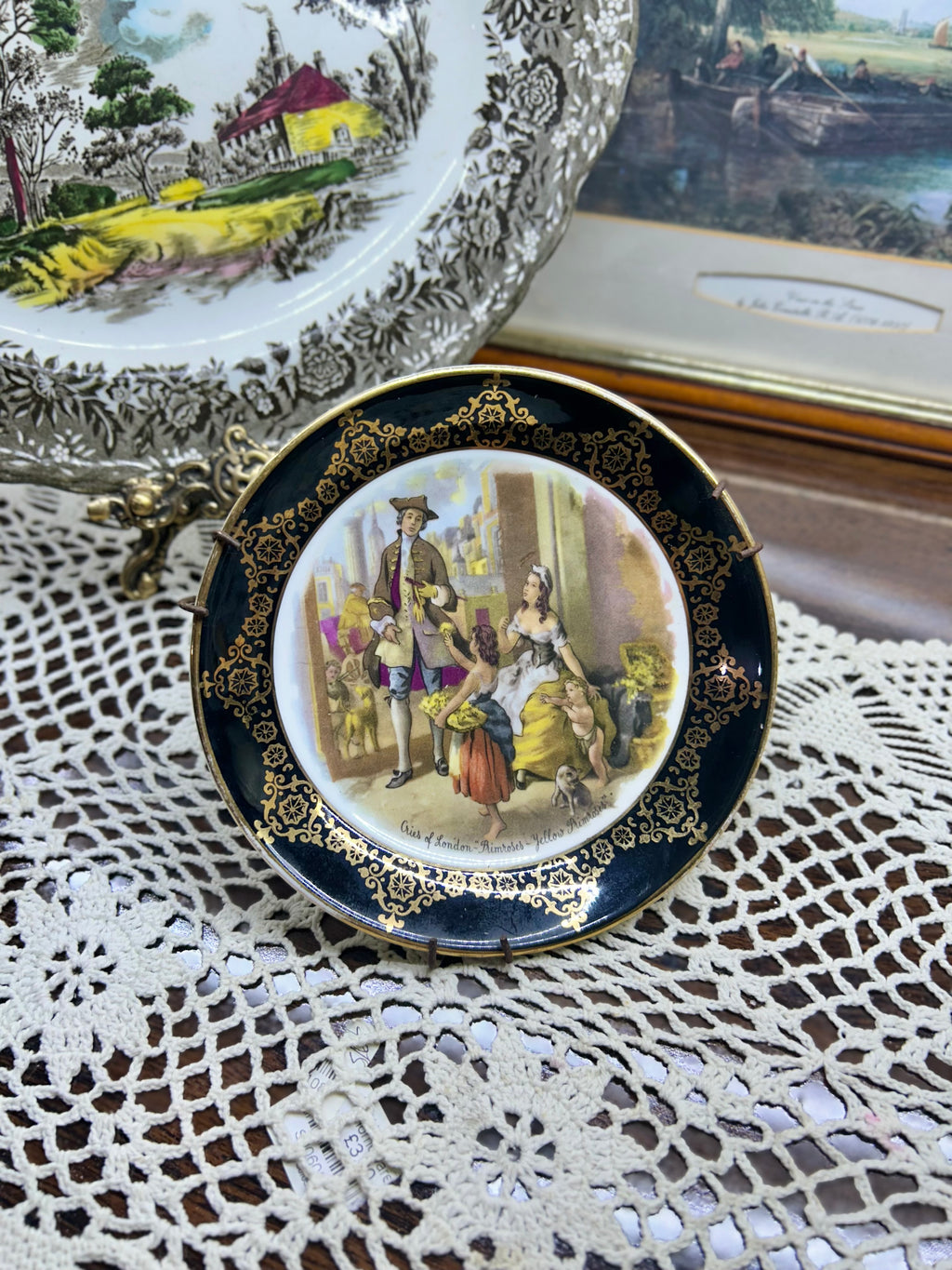 Vintage collector plate featuring a "Cries of London" scene, produced by Regency Bone China