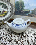 Classic white teapot by the cameo China Blue Lotus collection.