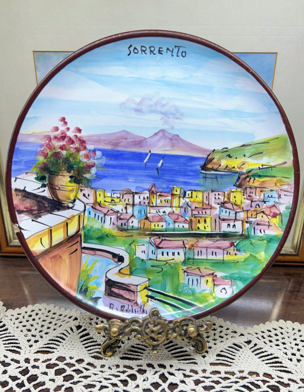 hand-painted ceramic decorative plate featuring a scene from Sorrento, Italy.