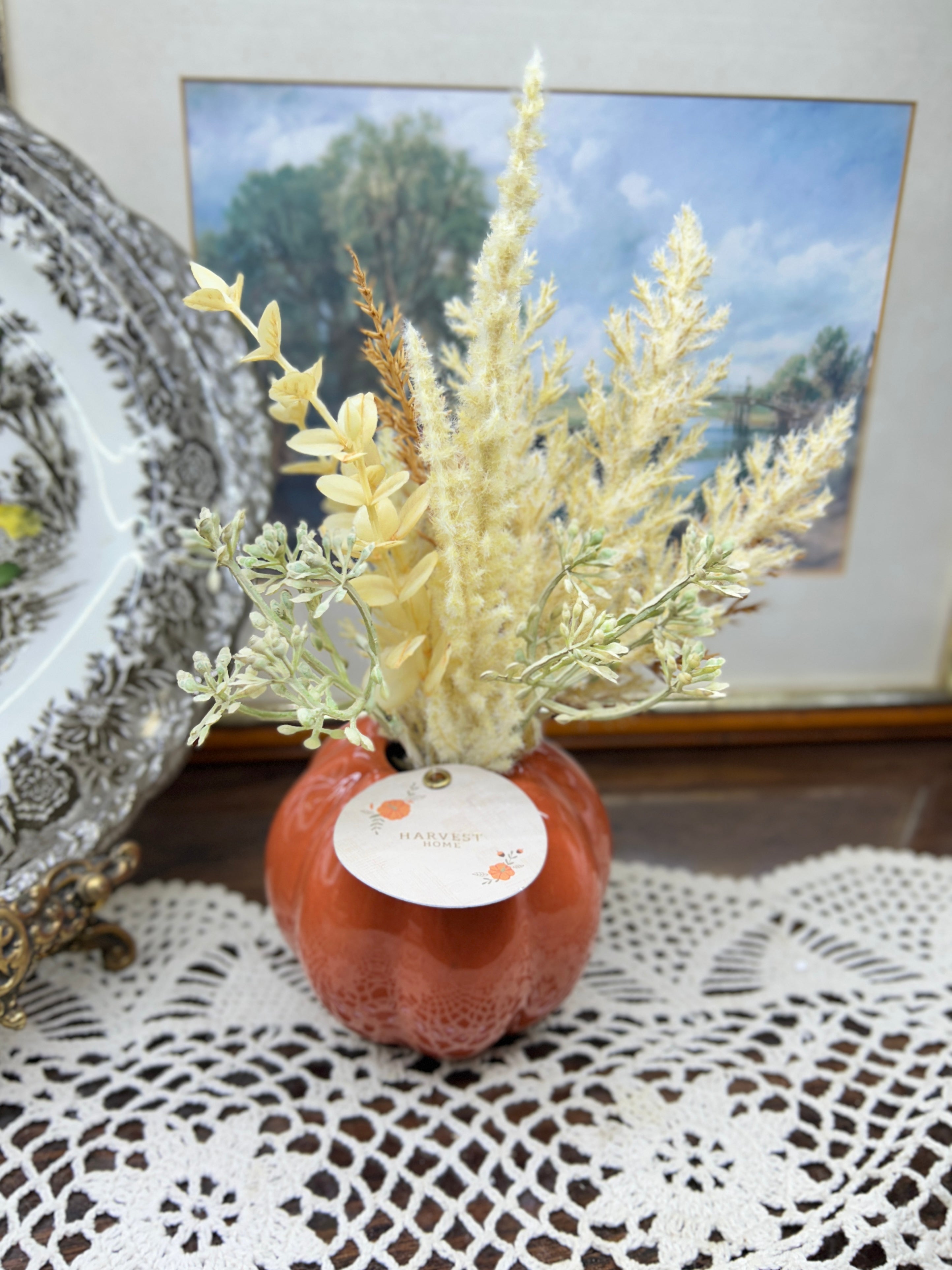Harvest Home  orange pumpkin-shaped ceramic vase filled with dried pampas