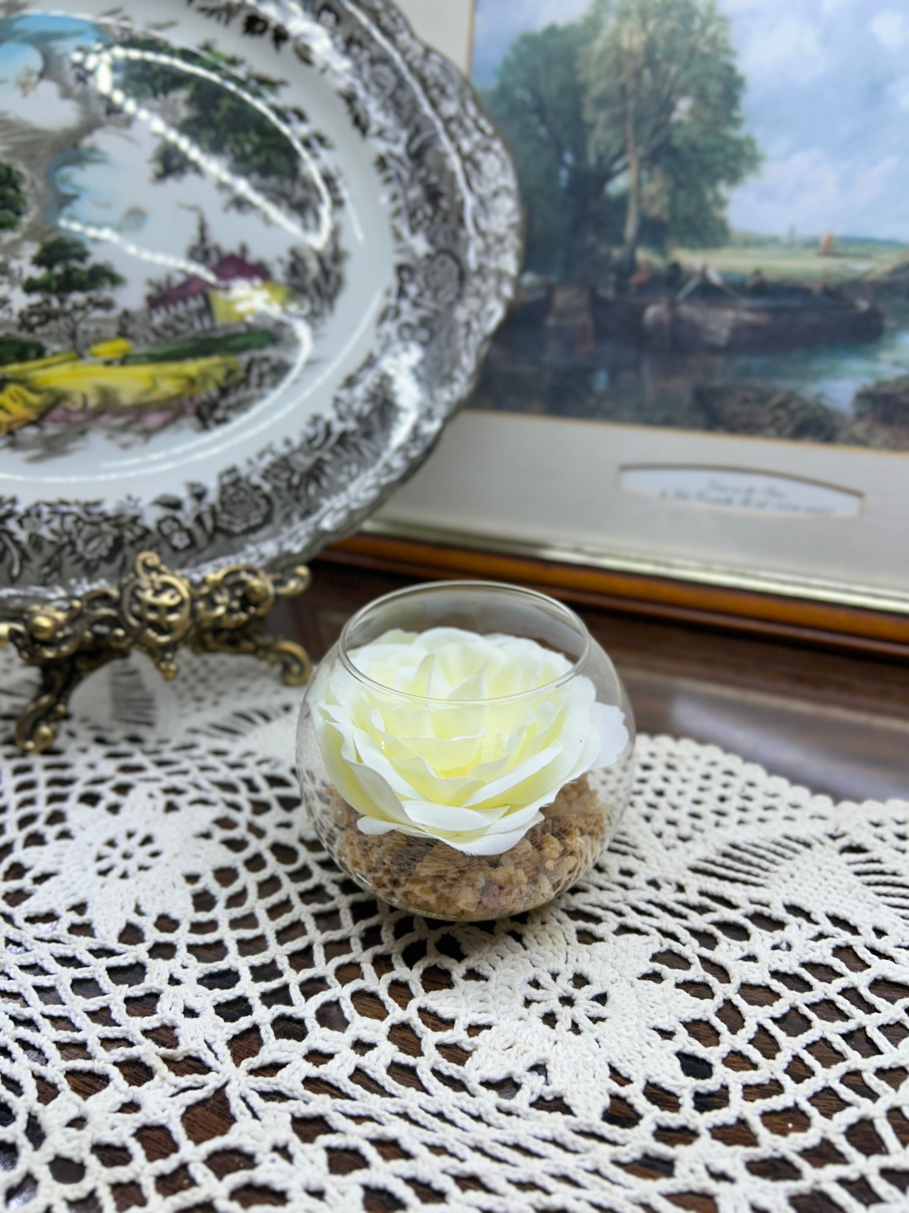Decorative white rose in a glass bowl — England