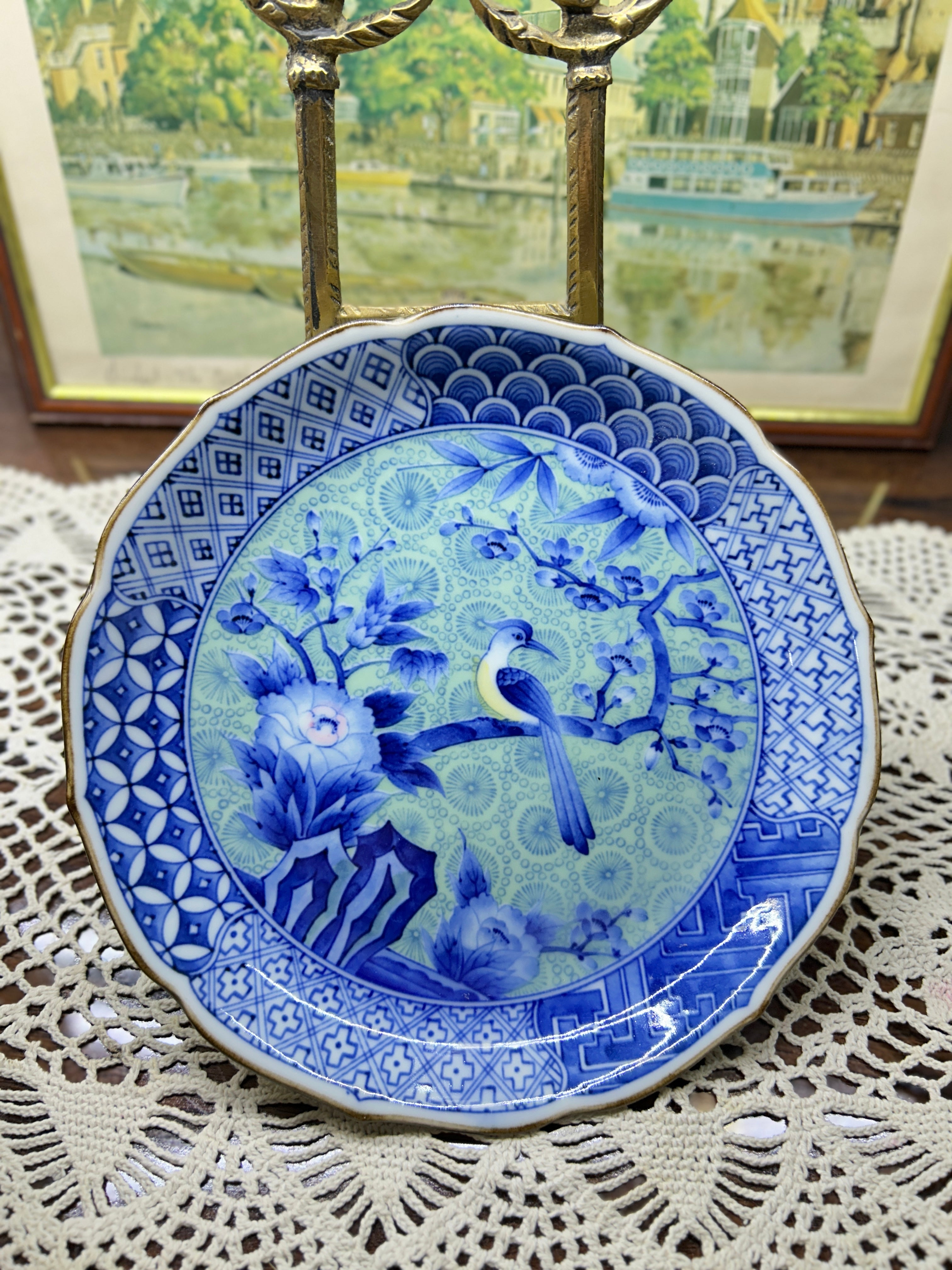 Japanese Arita-yaki porcelain plate features a detailed bird and floral motif 7”