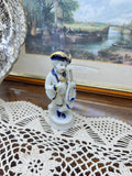 Vintage Capodimonte porcelain figurine features a boy playing a mandolin 5”