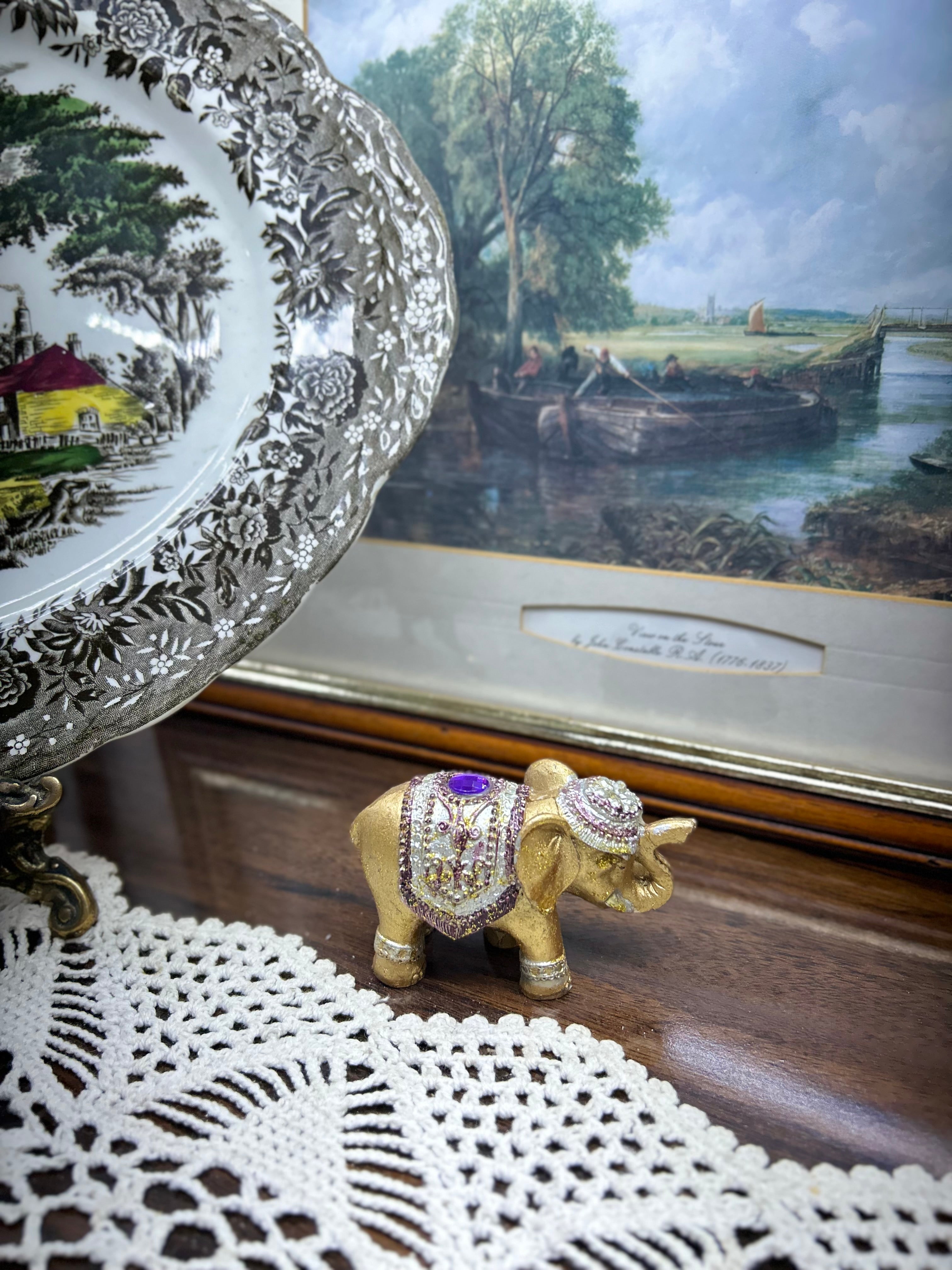 Decorative hand-painted gold elephant figurine