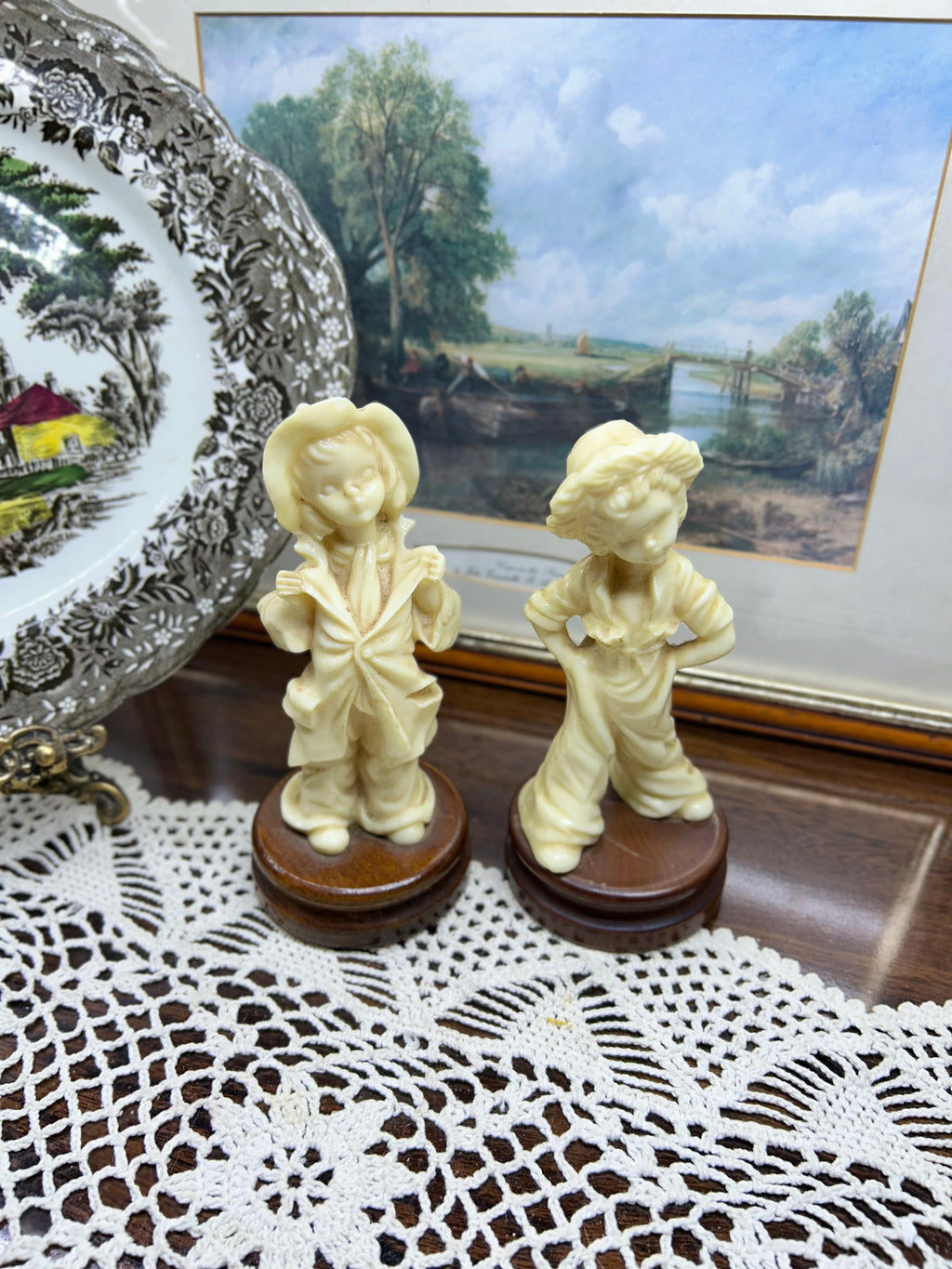 Vintage pair of Italian-made sculptures with wooden bases