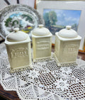 Vintage French style white ceramic canisters with embossed labels and cut-out bases — SET OF 3