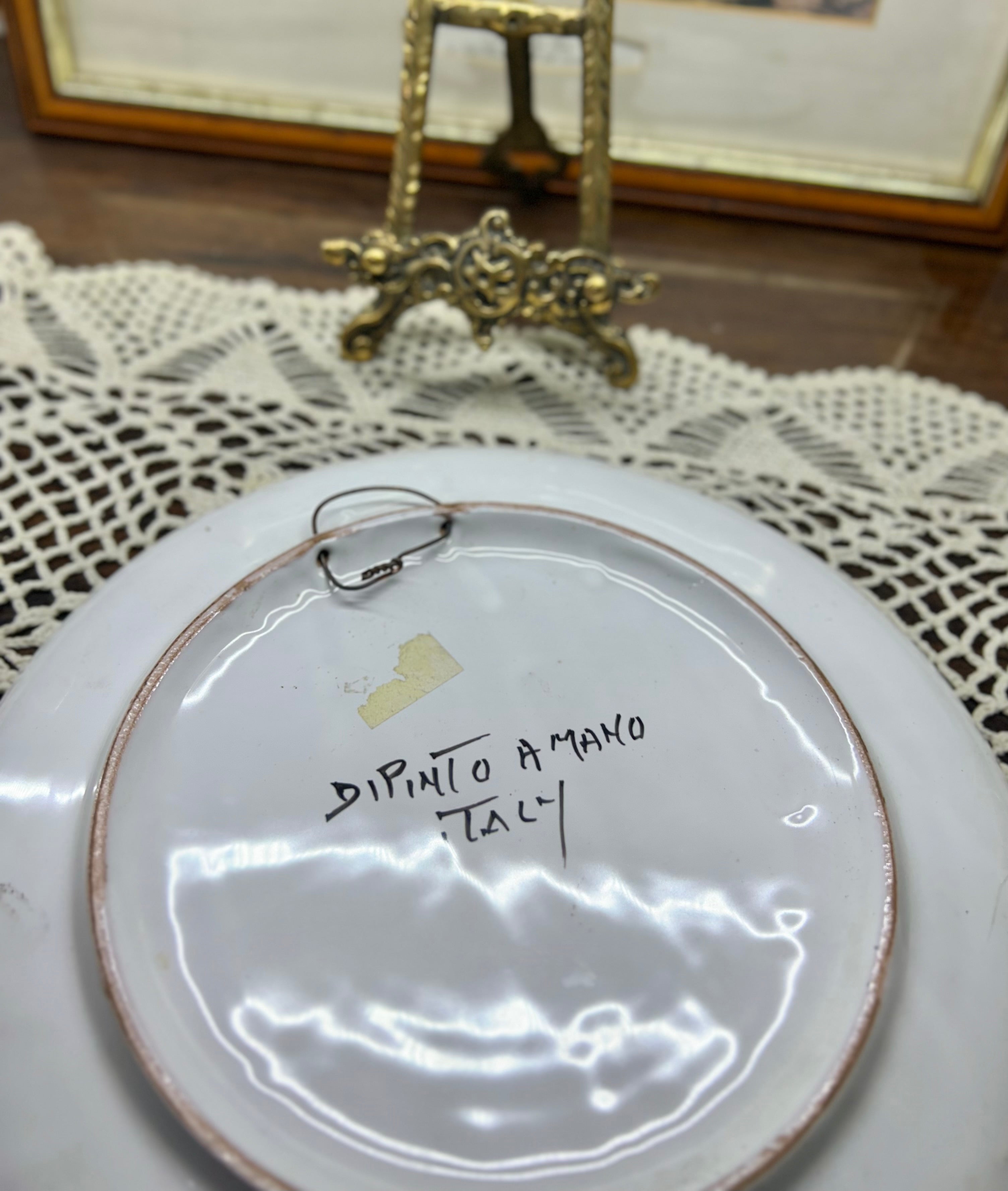 hand-painted ceramic decorative plate featuring a scene from Sorrento, Italy.