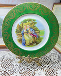 French porcelain display wall plate featuring a Fragonard courting couple scene 11”