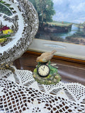 Leonardo Collection Porcelain Robin Figurine featuring a small clock embedded in the base