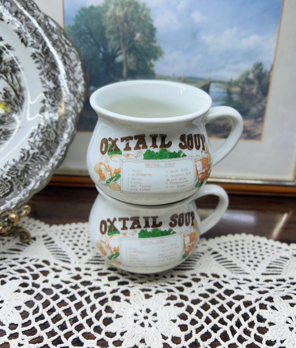 Retro ceramic soup mugs featuring an Oxtail Soup recipe design — pair