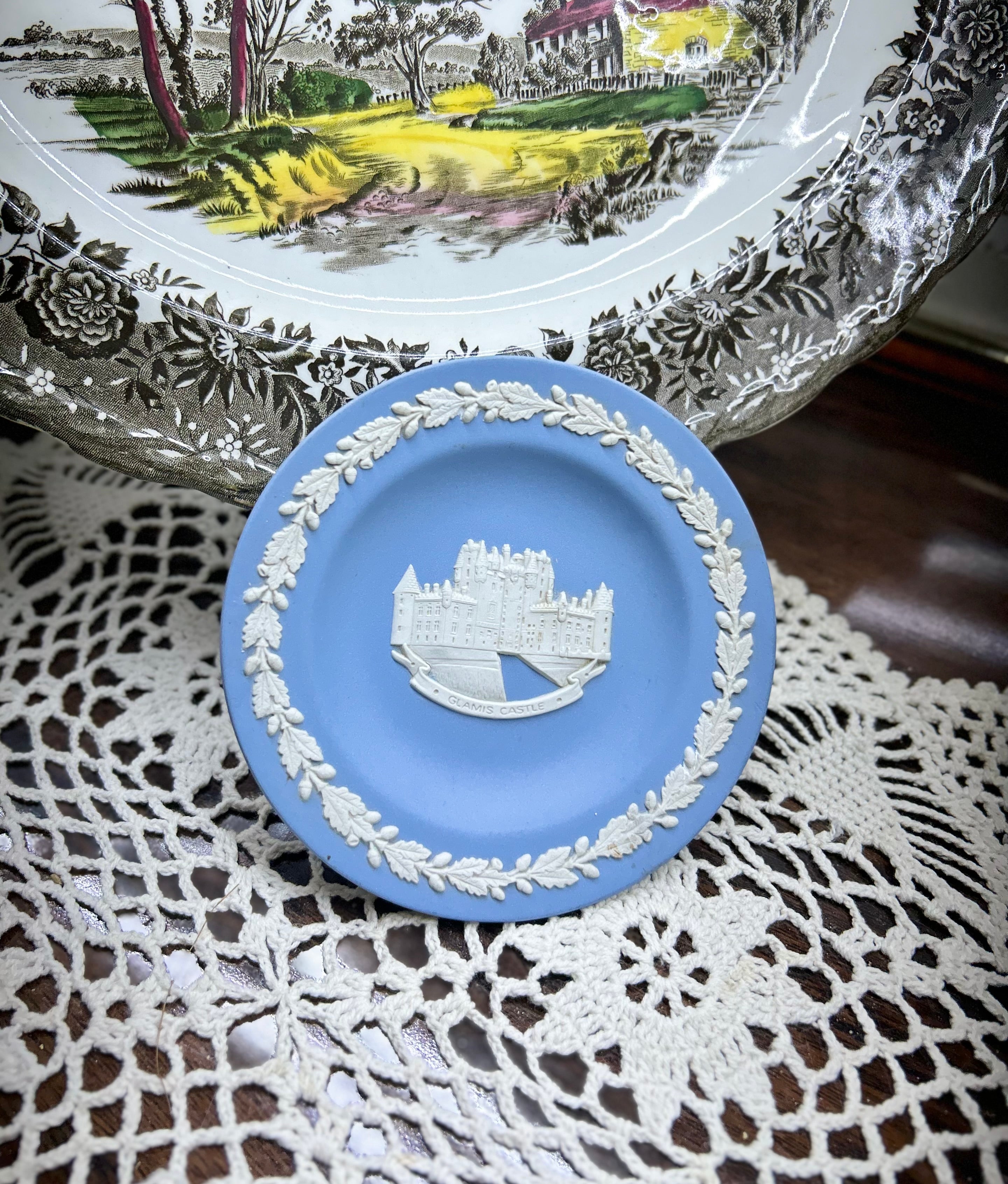 Wedgwood blue jasperware trinket plates — featuring white cameo reliefs of various landmark scenes
