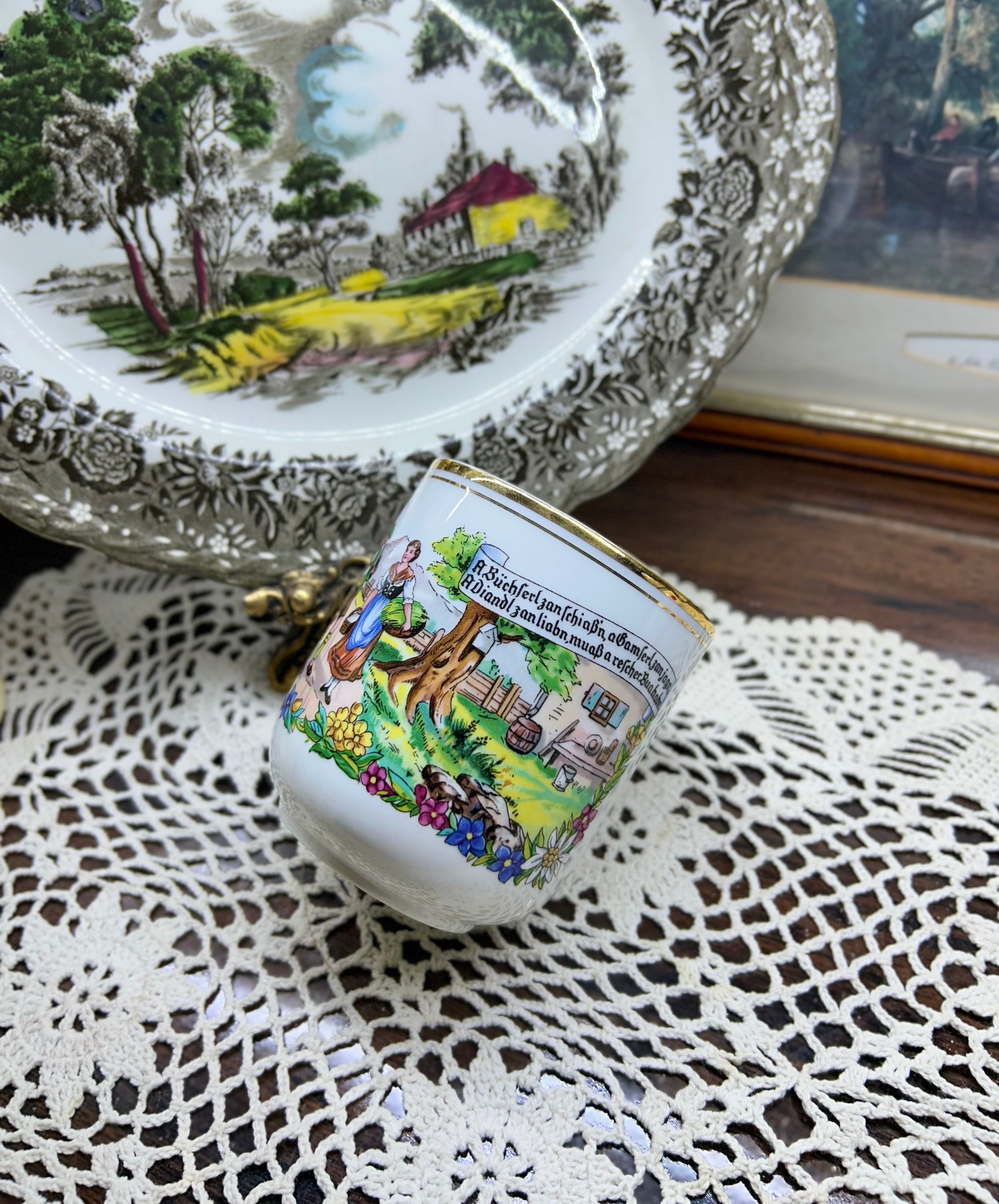 Vintage Austrian porcelain souvenir mug with a traditional folk scene — gold trim