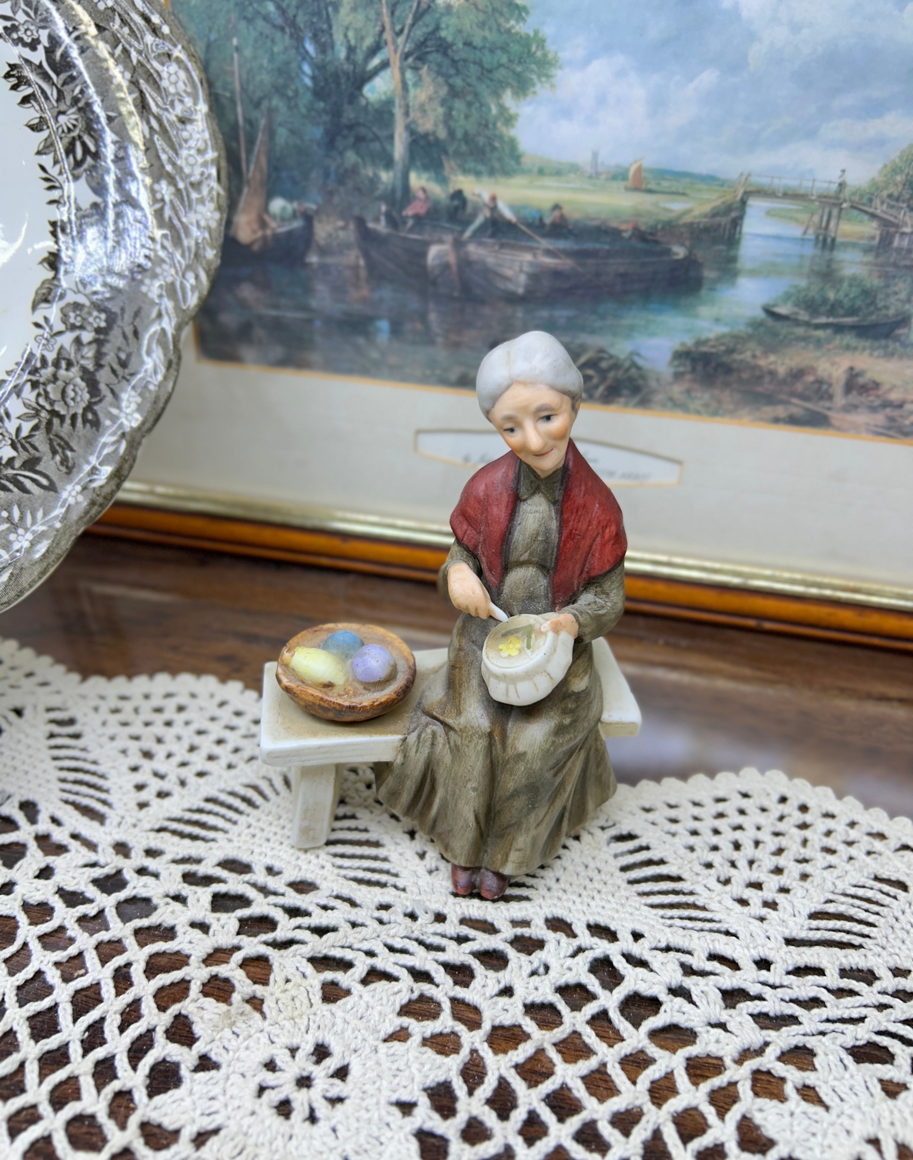 Vintage capodimonte figurine featuring an old lady sitting on a bench —  5”