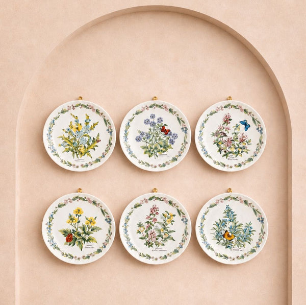 Series of seven plates from the “herbs by ROYAL WORCESTER” collection — limited edition botanical design 7”