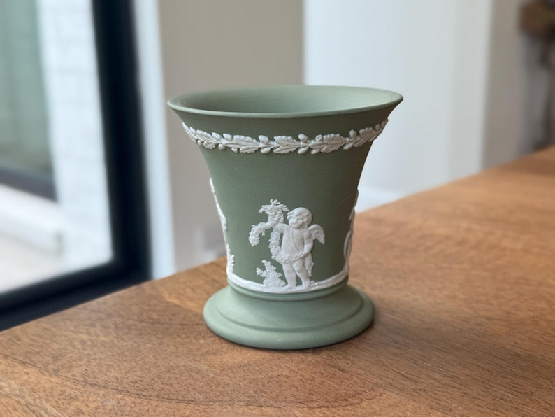 Vintage Wedgwood sage green Jasperware flared trumpet vase — featuring neoclassical putti bas-relief figures.
