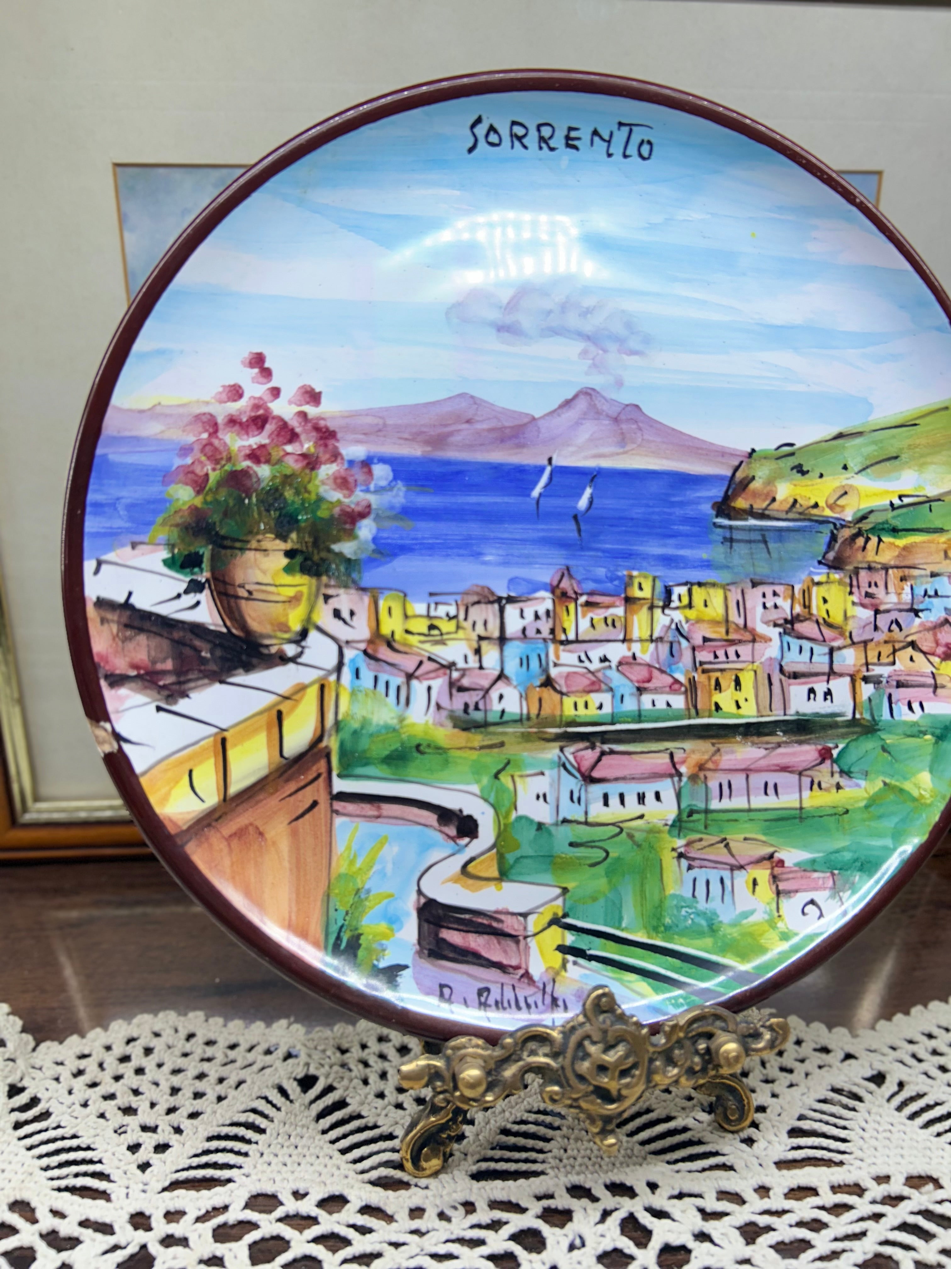 hand-painted ceramic decorative plate featuring a scene from Sorrento, Italy.