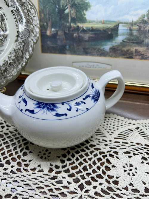 Classic white teapot by the cameo China Blue Lotus collection.