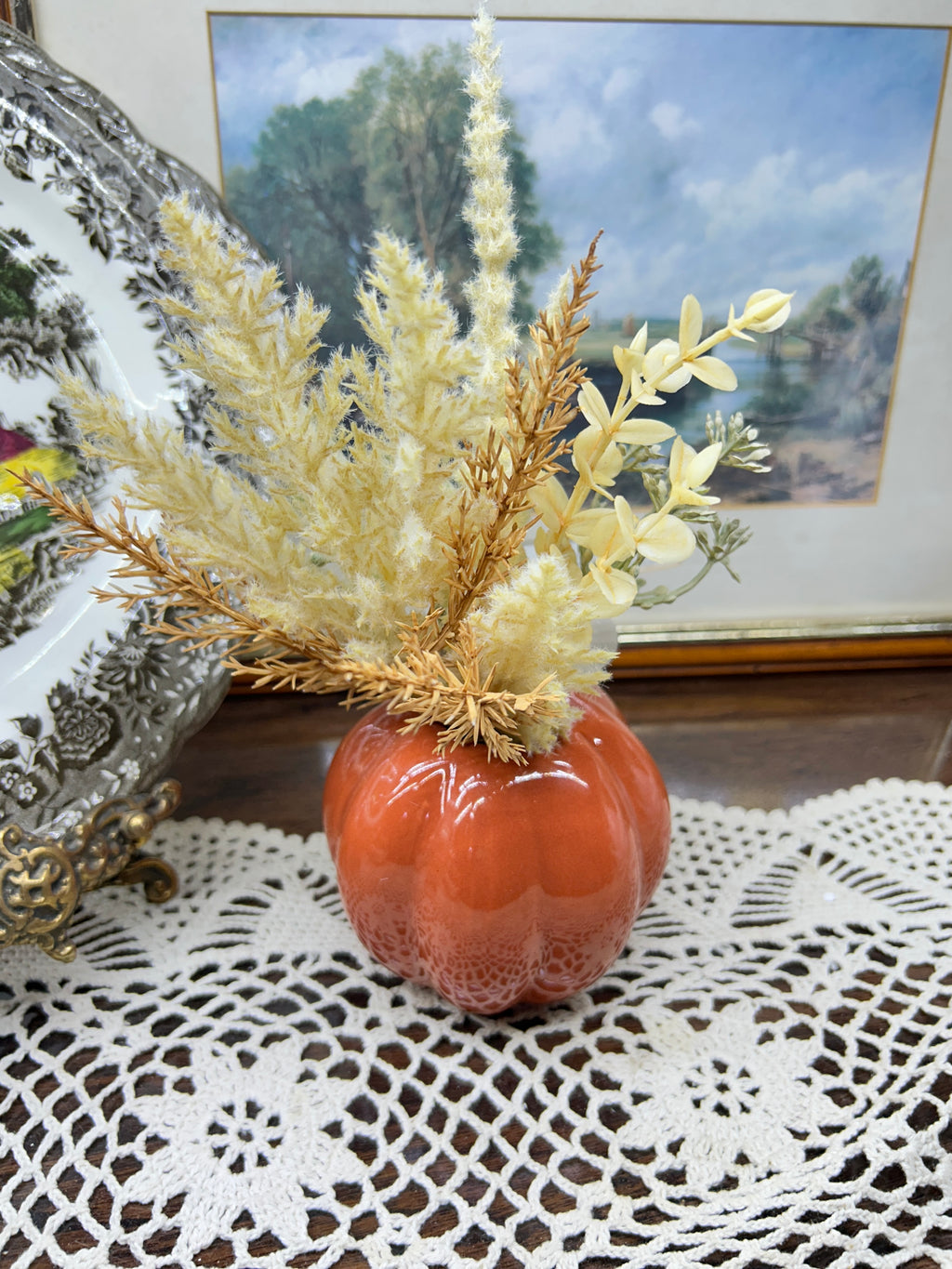 Harvest Home  orange pumpkin-shaped ceramic vase filled with dried pampas
