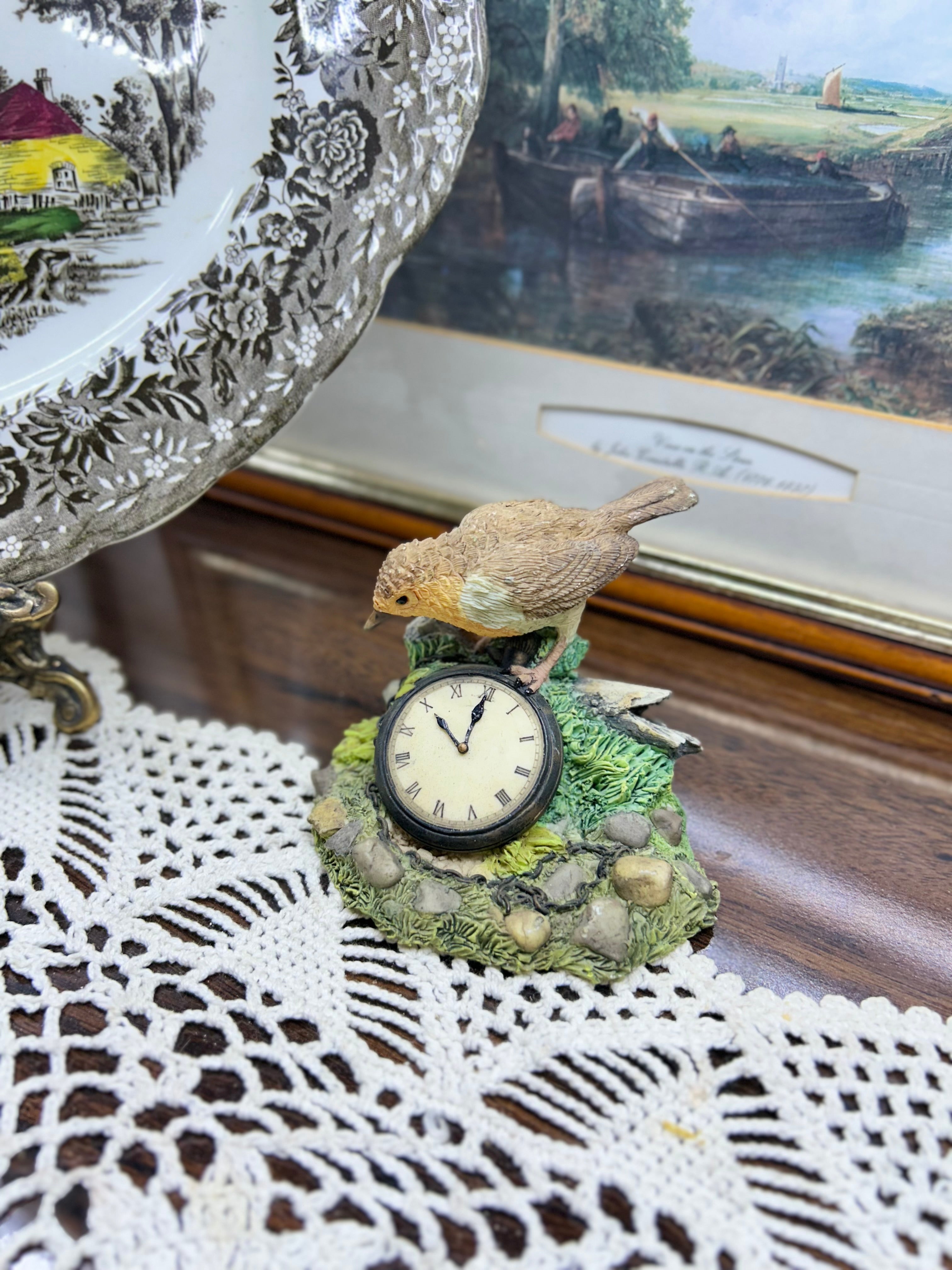 Leonardo Collection Porcelain Robin Figurine featuring a small clock embedded in the base