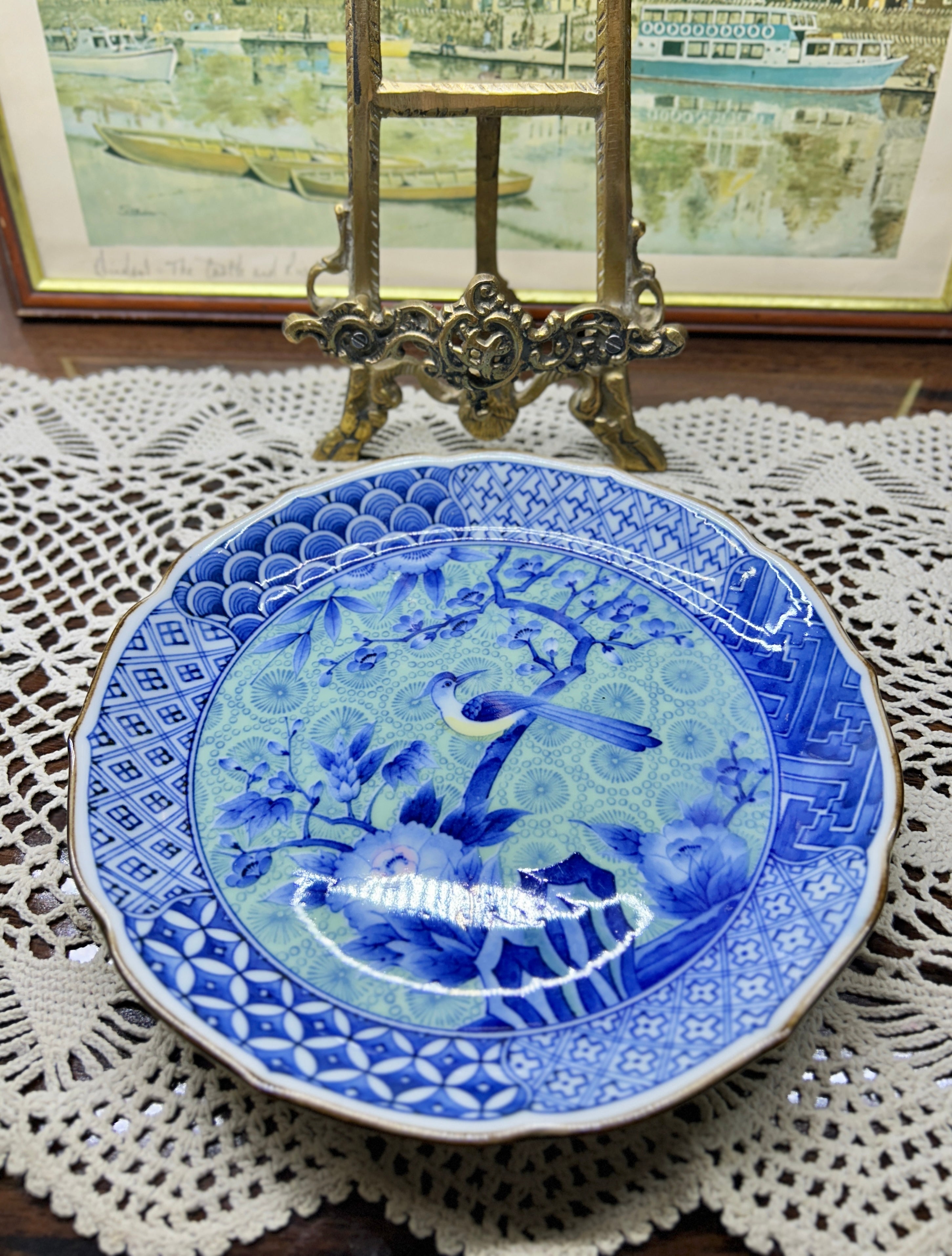 Japanese Arita-yaki porcelain plate features a detailed bird and floral motif 7”