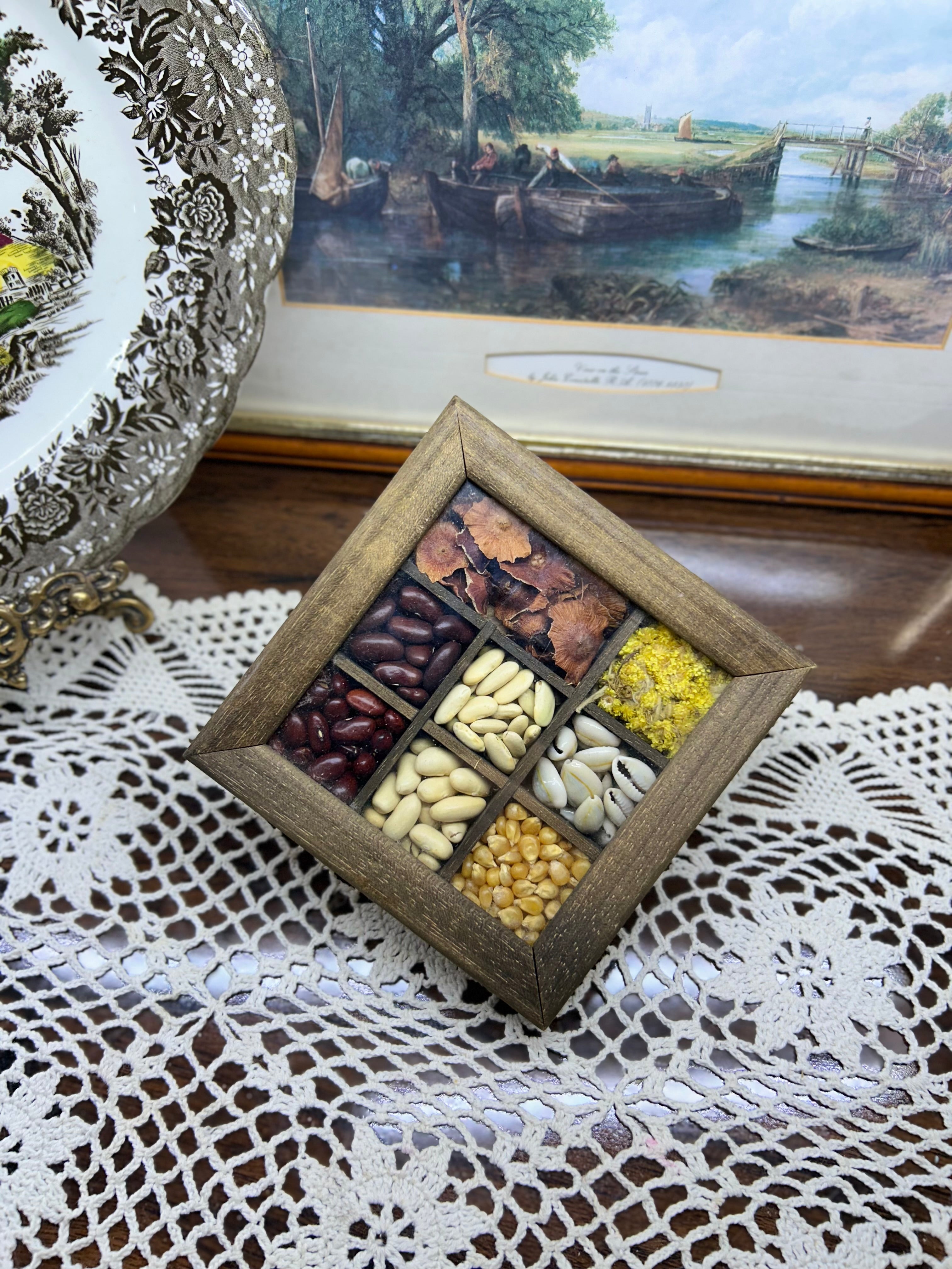 Wooden shadow box with dried seeds and grain for kitchen wall decor