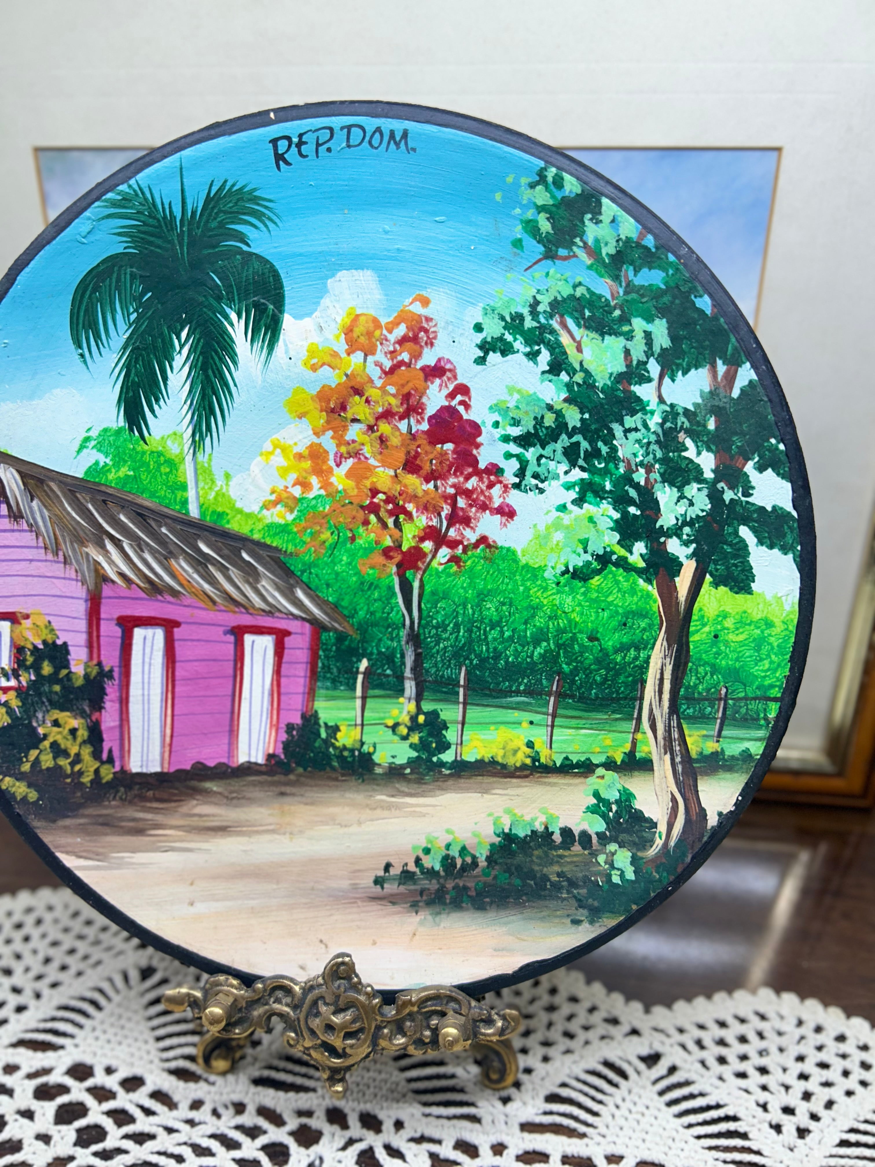 Hand-painted decorative plate featuring a vibrant Caribbean landscape from the Dominican Republic