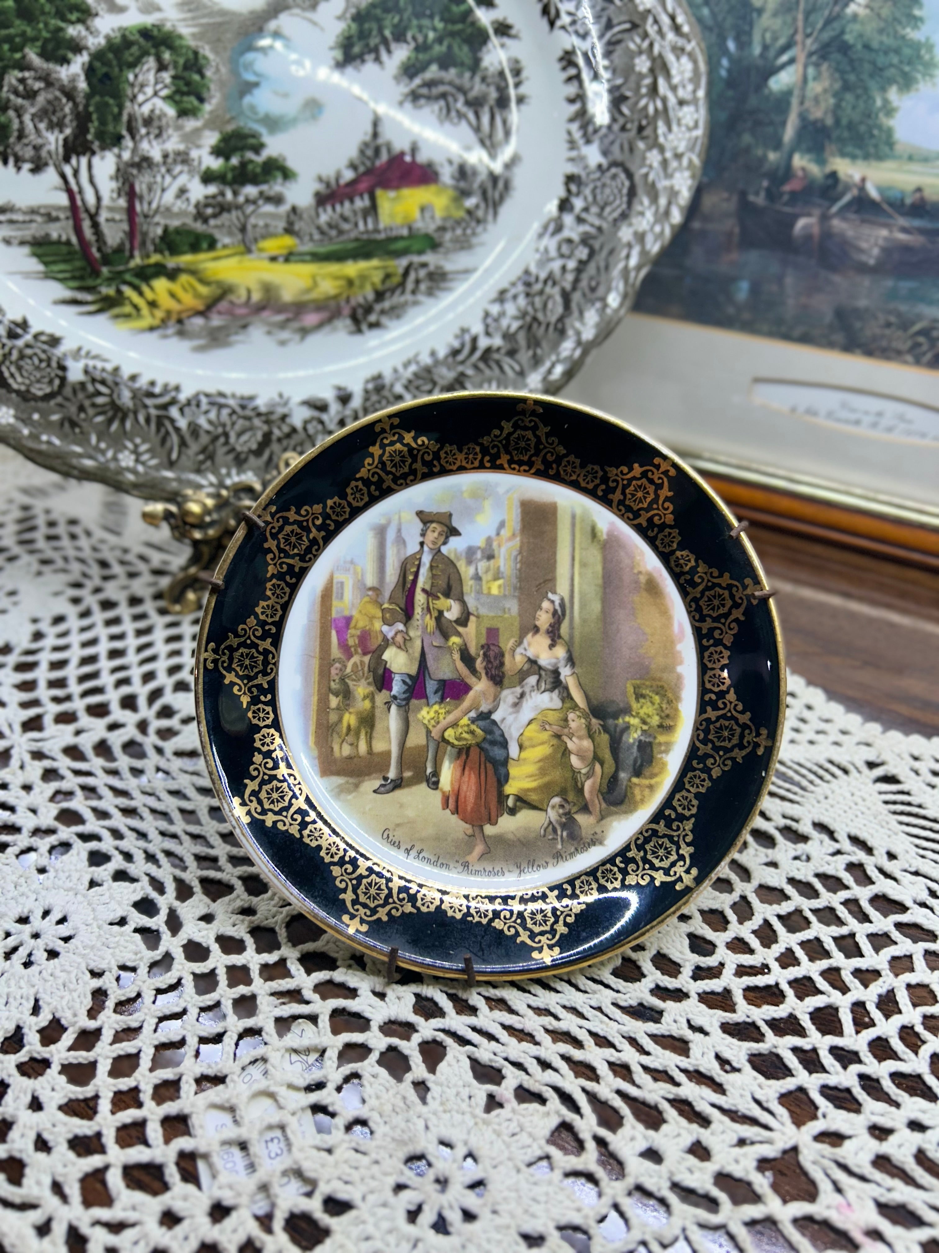 Vintage collector plate featuring a "Cries of London" scene, produced by Regency Bone China
