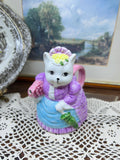vintage ceramic novelty teapot featuring a cat dressed in a Victorian-style purple dress and bonnet 7”