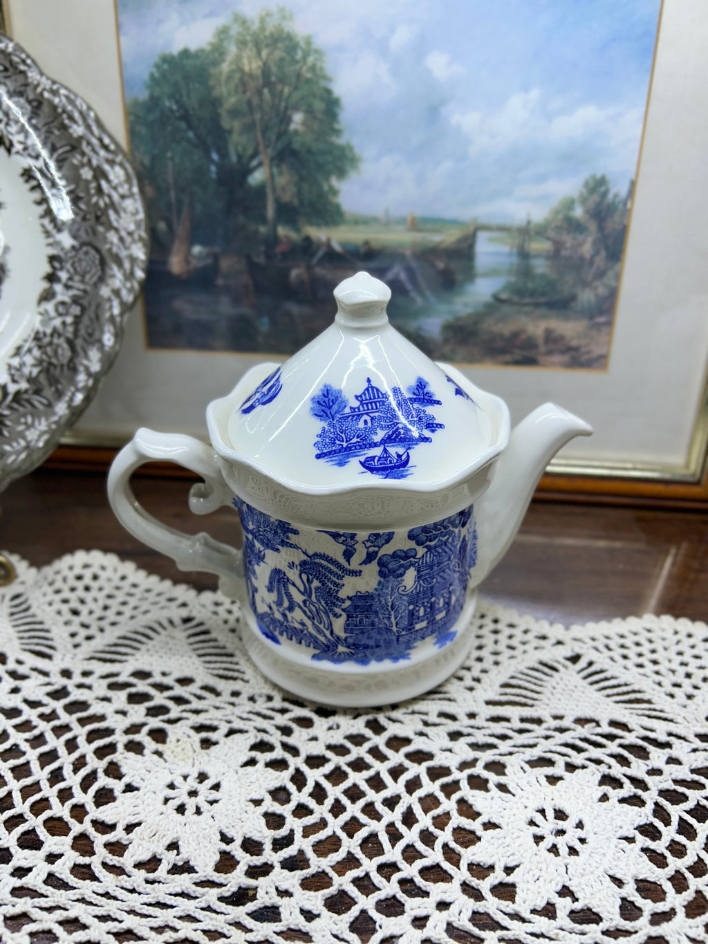 Vintage Shenango China teapot and matching creamer set featuring the iconic Blue Willow pattern.