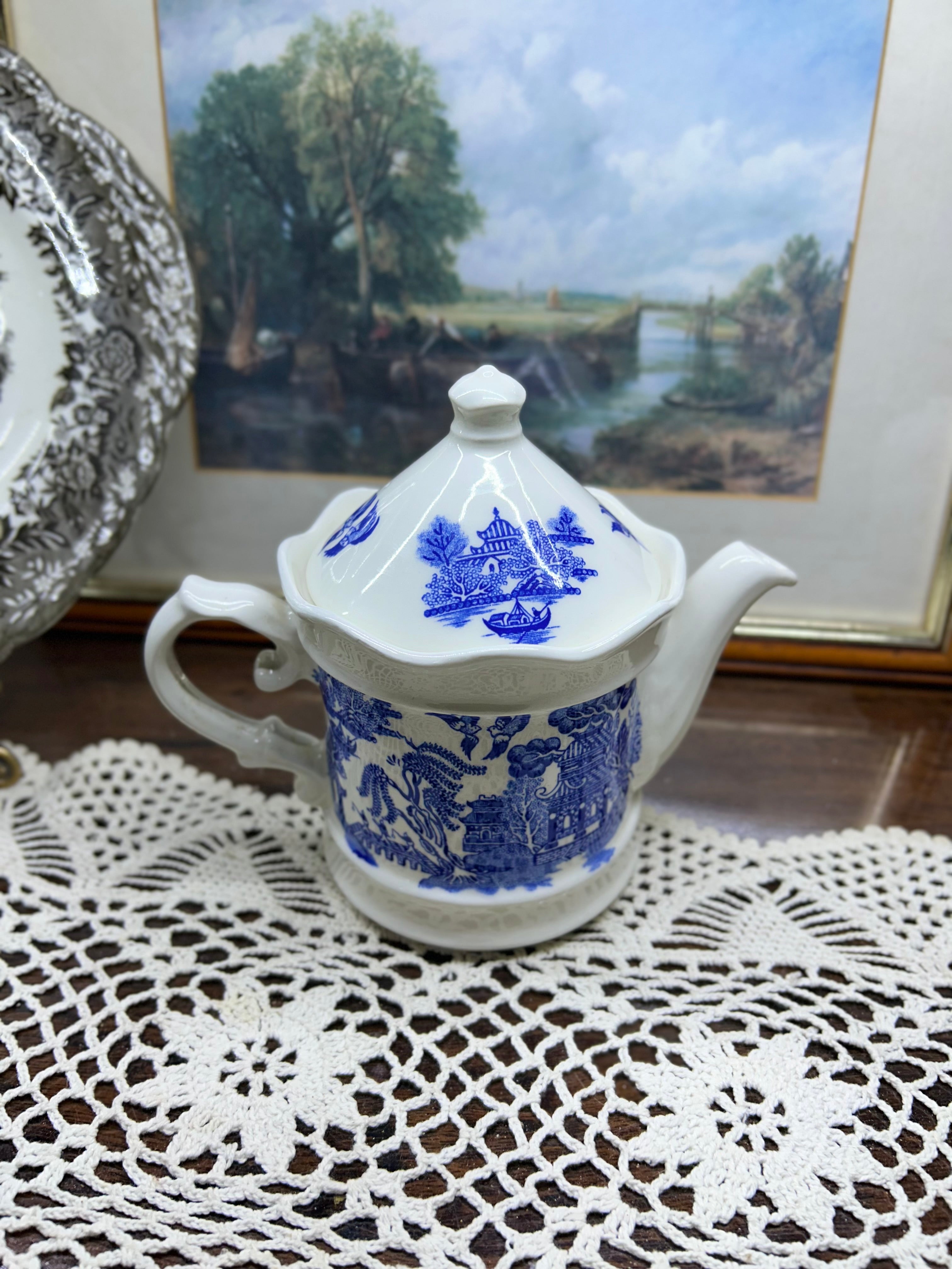 Vintage Shenango China teapot and matching creamer set featuring the iconic Blue Willow pattern.