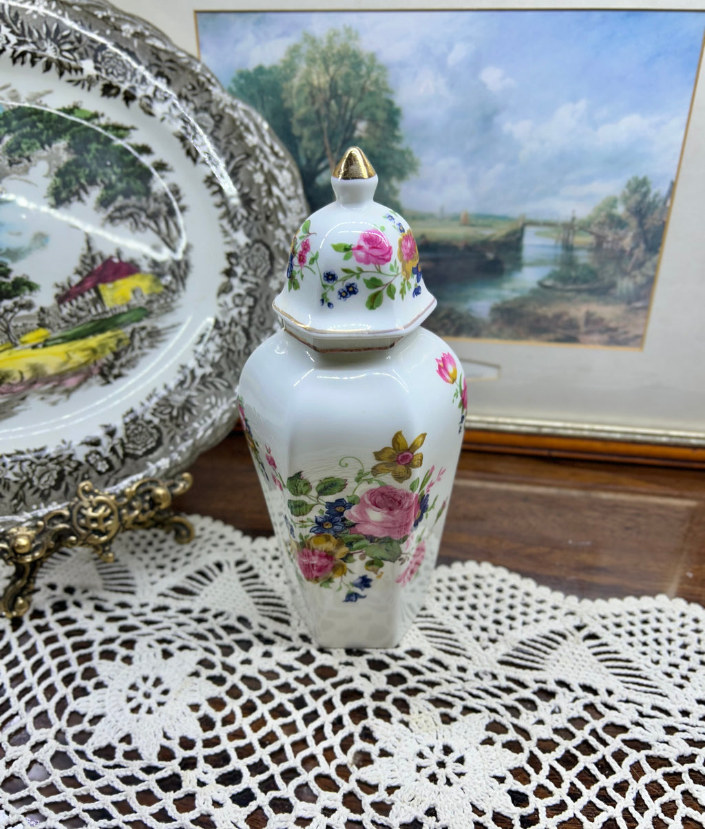 Vintage crown Staffordshire ginger jar — features a a vibrant floral pattern topped with a gold-accented lid 11”