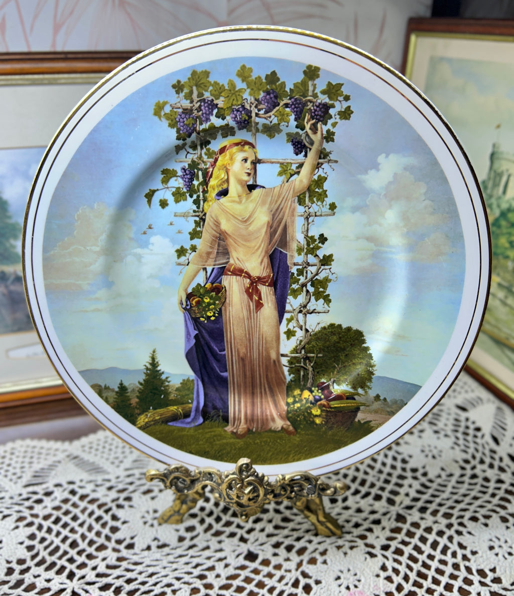 Vintage decorative wall plate "Seasons of the Year" series by artist Charlotte Sternberg 12”