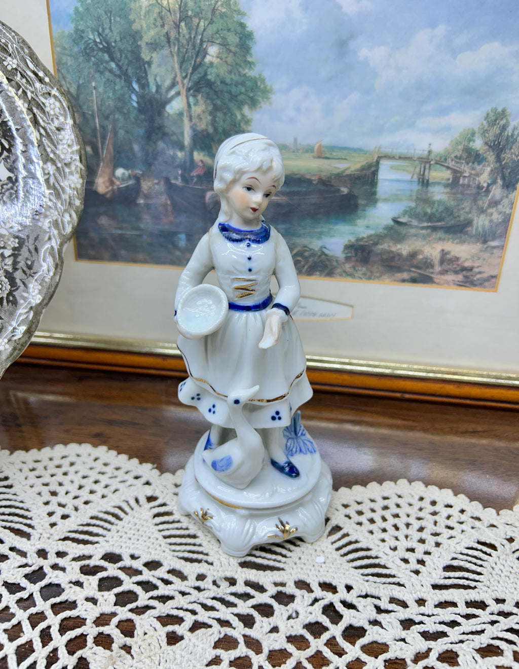 Vintage hand-painted figurine with blue accents featuring a girl with goose 6”