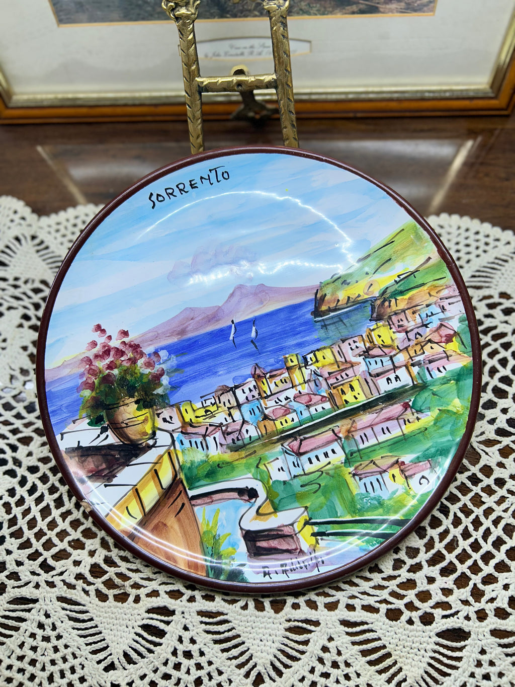 hand-painted ceramic decorative plate featuring a scene from Sorrento, Italy.