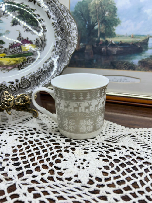 Christmas porcelain mug featuring a Nordic or "folk" pattern