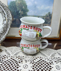 Retro ceramic soup mugs featuring tomato Soup recipe design.