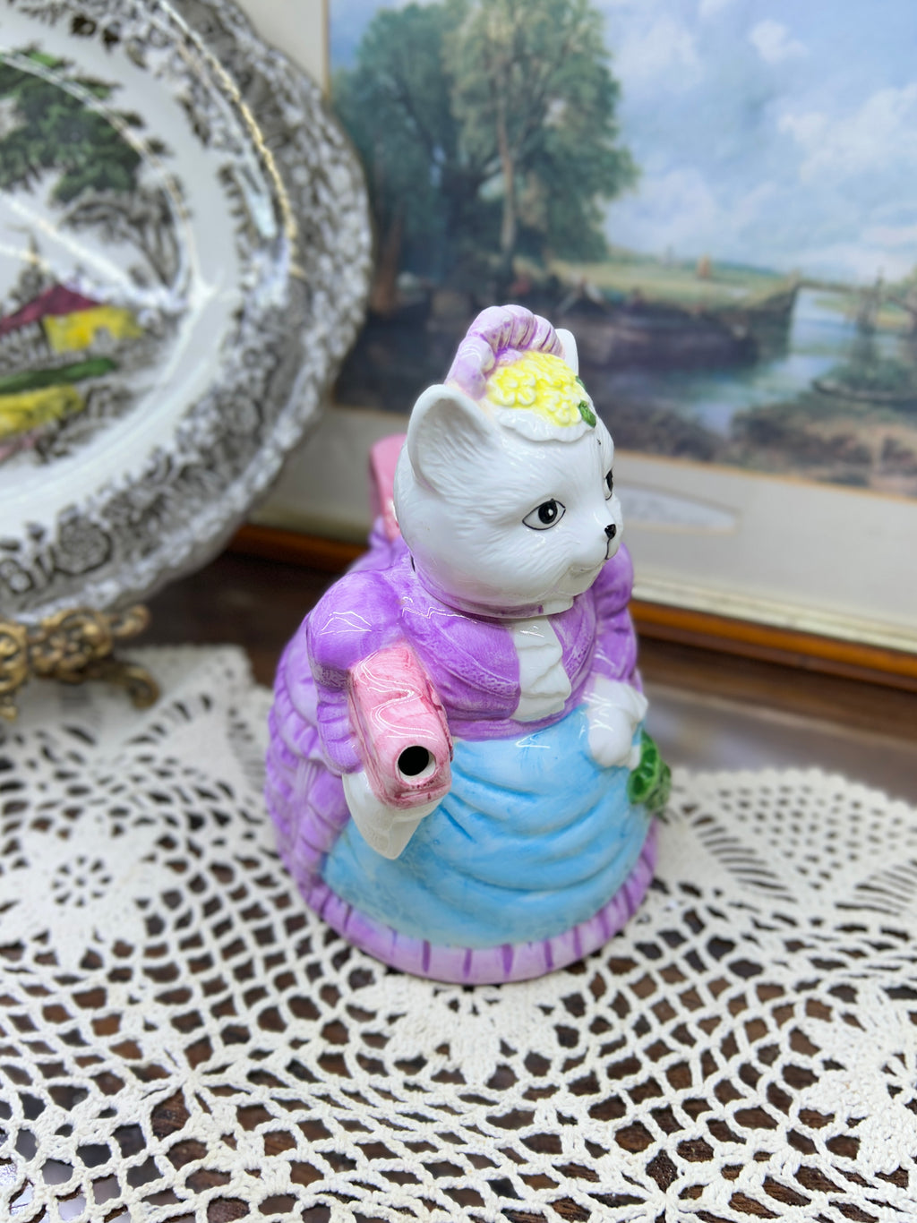 vintage ceramic novelty teapot featuring a cat dressed in a Victorian-style purple dress and bonnet 7”