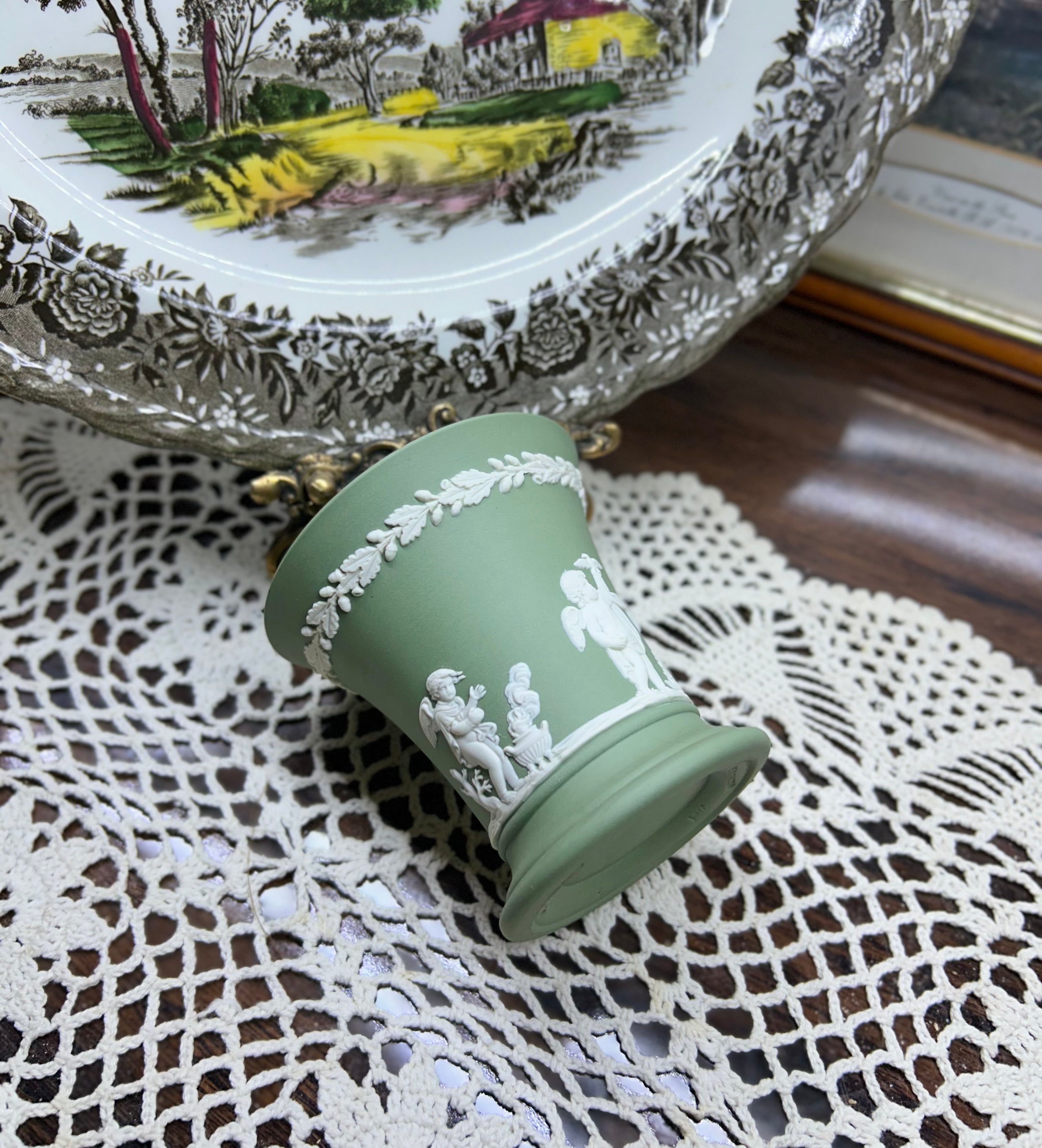 Vintage Wedgwood sage green Jasperware flared trumpet vase — featuring neoclassical putti bas-relief figures.