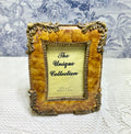Resin photo frame with ornate antique gold border