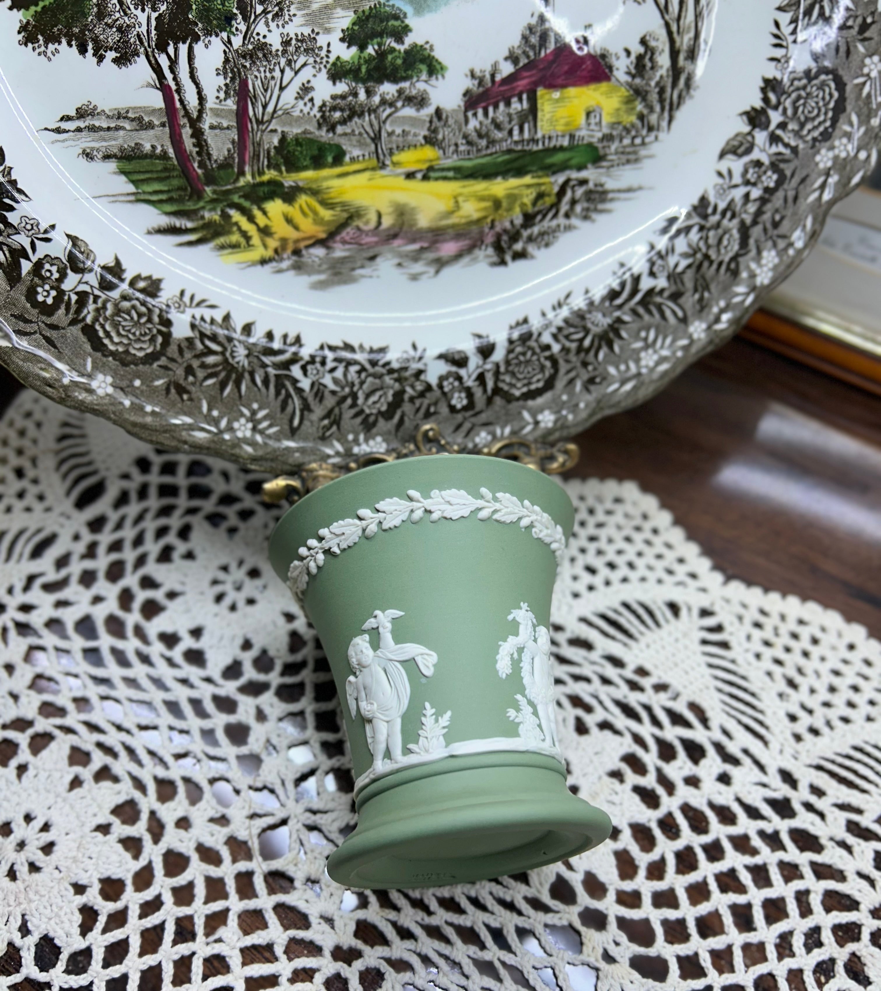 Vintage Wedgwood sage green Jasperware flared trumpet vase — featuring neoclassical putti bas-relief figures.