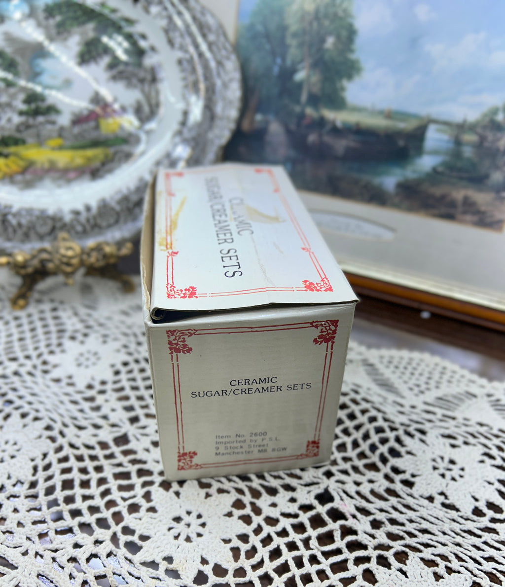 Glossy set of creamer & sugar pot adorned with ink iris floral designs — England