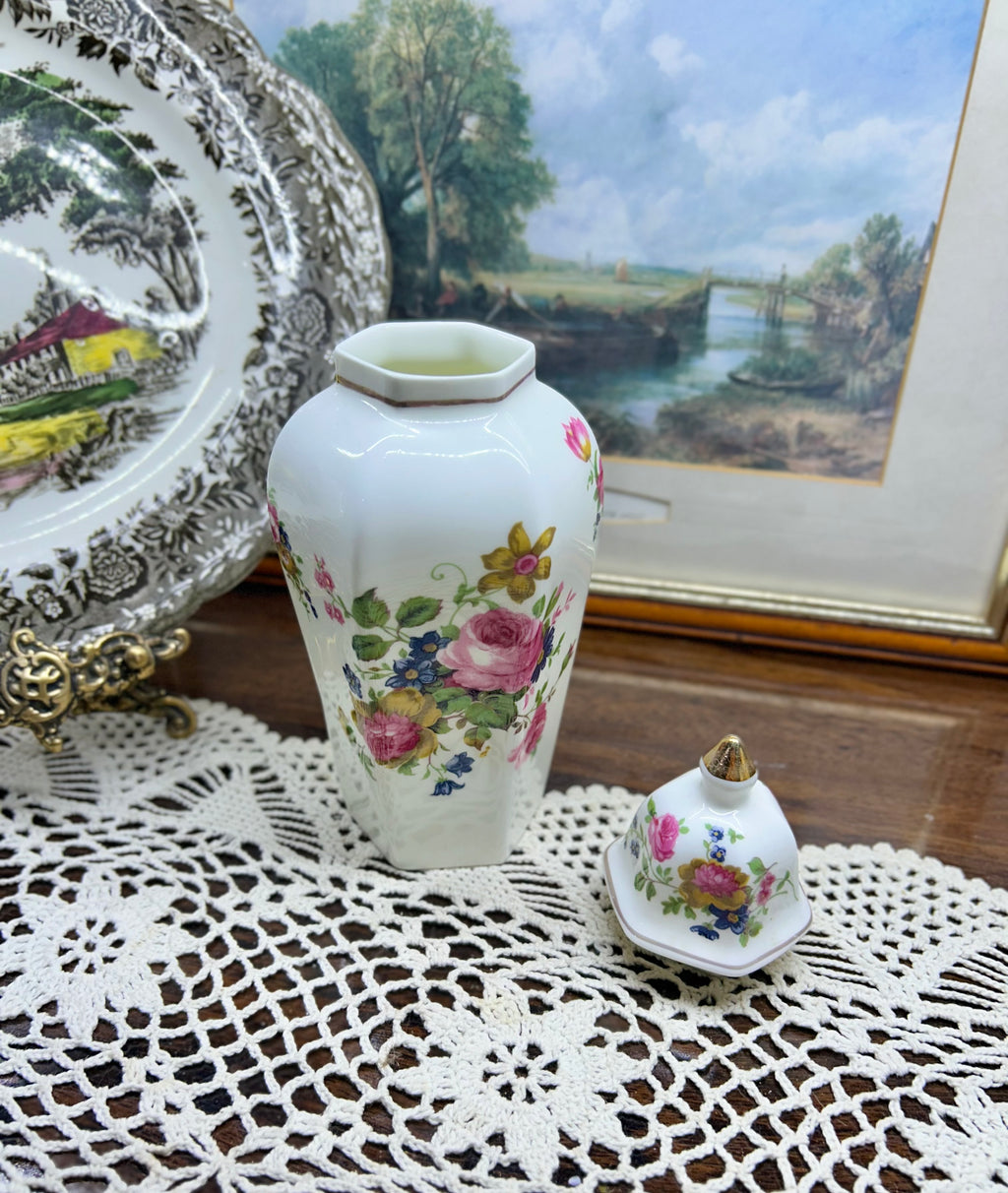 Vintage crown Staffordshire ginger jar — features a a vibrant floral pattern topped with a gold-accented lid 11”